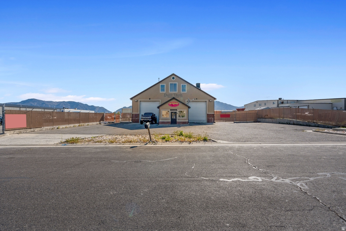 Industrial Warehouse 5600sf with 5600 sf office/meeting rooms/break area/kitchen area 1/2 acre with building and an additional 1/2 of outside storage for a total approximately 1 acre. Property has a shared access with adjoining property.