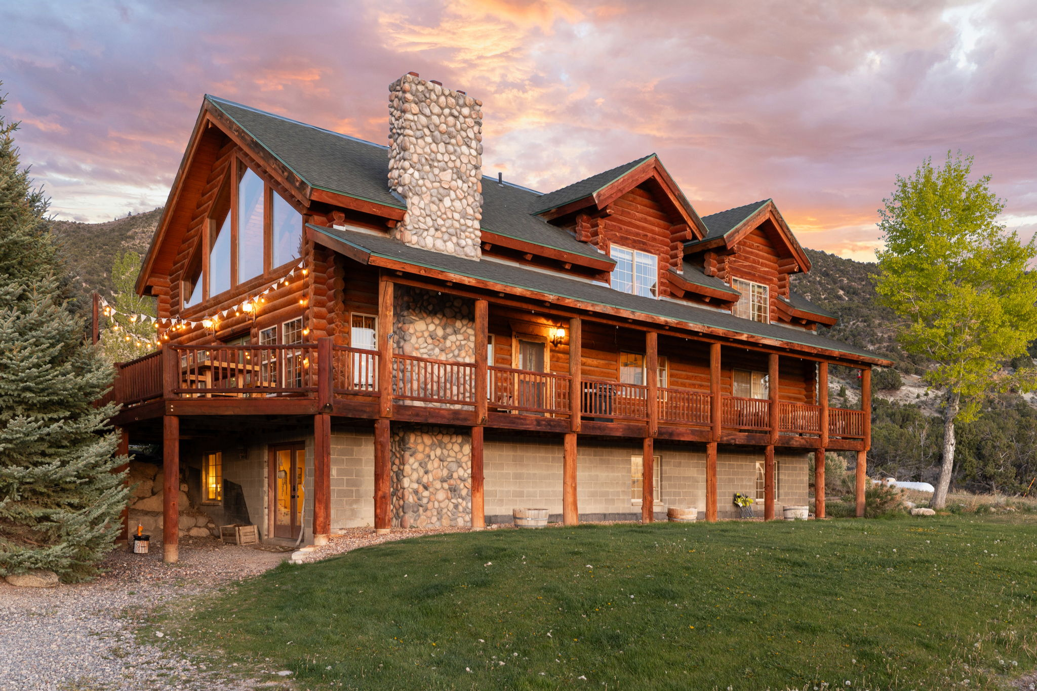 Luxury Log Estate | 10 Private Acres | Panoramic Manti Temple Views | Direct BLM Access | Turnkey Luxury Homestead | Income & Event Potential.  Elevated on 10 private acres just east of the iconic Manti Temple, this exceptional 4,200 sq ft custom log estate captures breathtaking, unobstructed valley views while backing directly to BLM land with immediate access to Skyline Drive. Rarely does a property combine luxury living, self-sufficiency, recreation, and income potential so seamlessly. Designed as a fully turnkey homestead, the property features a remarkable year-round Walipini greenhouse, large garden, hoop house, and an abundant producing orchard with apples, pears, peaches, cherries, grapes, apricots, walnuts, berries, citrus, figs, herbs, and more. A powered barn, fenced pasture with milk station, private well, irrigation shares, and 1.396 acre-feet water right complete an extraordinary agricultural setup. Whether your passion is horseback riding, ATV adventures, hiking, hunting, or simply enjoying unmatched privacy, direct access to thousands of acres of public land begins right outside your back door. After a day outdoors, relax in the beautifully crafted wood-fired sauna or wood-fired hot tub while taking in unforgettable mountain, valley, and Manti Temple views. Inside, expansive picture windows fill the home with natural light while showcasing the surrounding scenery. Warm wood finishes, multiple wood-burning fireplaces, premium Caf appliances, and timeless craftsmanship create an inviting mountain retreat designed for both everyday living and entertaining. The separate lower-level living quarters, complete with a private entrance, kitchenette, bathroom, and laundry, provide exceptional flexibility for multi-generational living, guests, caretaker quarters, or income-producing opportunities. Combined with the property's history of hosting weddings and special events, this estate offers exciting possibilities for private retreats, executive getaways, corporate events, vacation rentals, or other short-term lodging opportunities, subject to buyer verification of all applicable zoning, licensing, and local regulations. This is more than a home-it's a lifestyle unlike any other in Sanpete County. Complete with direct BLM access, private well, irrigation shares, valuable water rights, powered barn, luxury amenities, and endless recreational opportunities, this one-of-a-kind estate is nearly impossible to replicate. All information within is provided as a courtesy only.  Buyer and Buyer's Agent are advised to complete their own due diligence and independent measurements. Property and boundary lines are shown as approximate.
