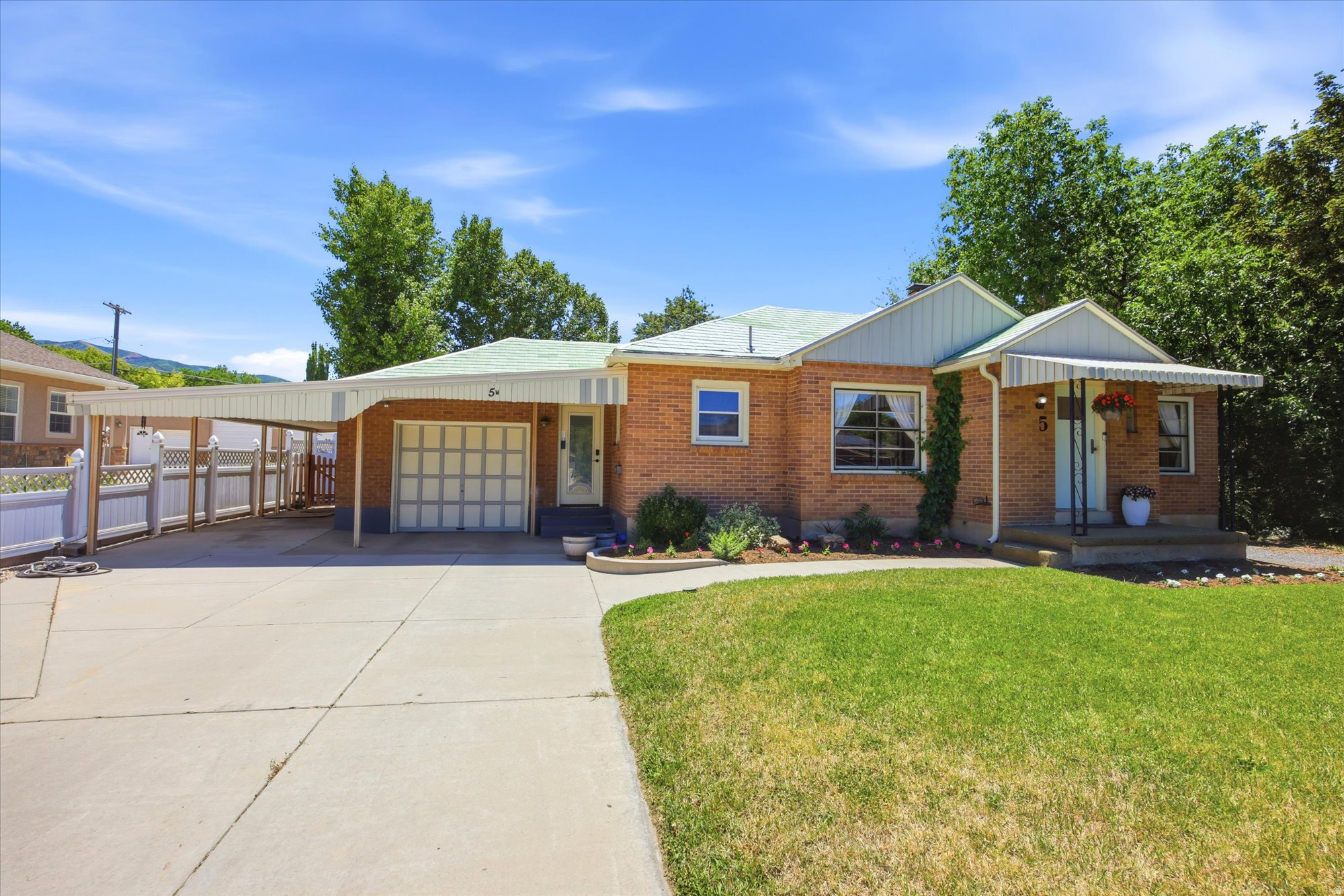 LAUNCH SCHEDULED for 11:00 AM - SATURDAY 6/27/2026 - OPEN HOUSE!  In the heart of Bountiful, UT (84010), on a quiet street where the schools are an easy walk away, sits a classic brick rambler with real mid-century character - and a list of updates most homes this age never get. This 4-bedroom, 2-bathroom single-level home has been remodeled where you can see it AND where you can't: an updated kitchen, remodeled bathrooms, and a fully finished basement, plus the work that actually protects you - a new sewer line, 50 year metal roof, updated plumbing and electrical, newer furnace and central air, fresh flooring, paint, and new concrete. Step inside to a large, open front room built for gathering and an easy-flowing open floor plan. Downstairs, the spacious basement family room features built-in shelving and a hidden storage room. Outside, you'll find a fully fenced, private backyard made for entertaining - plus a detached garage/workshop with power at the back of the property, ready for projects, storage, or your next hobby. This is the kind of Bountiful home that doesn't sit long: solid bones, smart updates, walkable to schools, and truly move-in ready. No projects waiting on you. No surprises hiding underground. Just a well-cared-for home in one of Davis County's most desirable neighborhoods, ready for its next owner. Schedule your private showing today.