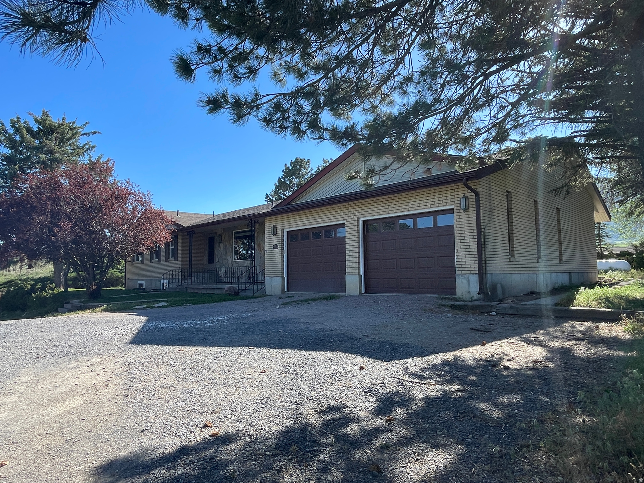 A Rare Rural Retreat - Space, Self-Sufficiency & Stunning Views 6 Acres | 3,600 Sq Ft | 5 Bed | 3 Bath | 2,600 Sq Ft Shop | Clifton, ID  Welcome to one of the most thoughtfully equipped rural properties on the market. Nestled on 6 fully fenced acres with sweeping panoramic views of the surrounding mountains and Oxford Reservoir, this exceptional home offers the privacy, preparedness, and wide-open space that so few properties can genuinely deliver. Whether you're a horse or livestock owner, a hobby farmer, or someone who values true self-sufficiency, this property was built - and upgraded - with purpose. The Home At 3,600 square feet, the 5-bedroom, 3-bathroom brick home offers generous living space across two levels, including a fully finished walk-out basement with apartment conversion potential - ideal for multi-generational living, rental income, or an additional retreat. Two wood-burning stoves on the main level and basement add warmth and reliability, while central air and forced-air heating keep every season comfortable. Built for Self-Sufficiency This property goes far beyond the average rural home. A whole-home solar system paired with a dual-fuel backup generator means the lights stay on. A 1,000-gallon owned propane tank, 120-gallon basement water retention storage, whole-house water softener with reverse-osmosis purification, dedicated food storage room, and a large root cellar make off-grid-ready living a genuine reality - not just an aspiration. For Your Animals & Your Work Two pastures and fencing across the full 6 acres provide ample, secure space for horses, cattle, or other livestock. A massive 3-bay shop (approx. 2,600 sq ft) with a loft and dedicated tack shed handles every project and every piece of equipment. Two Richie automatic waterers serve your animals with ease, and a sweeping circular driveway adds both function and curb appeal. The Setting Private, quiet, and jaw-droppingly beautiful - this property offers views in every direction, with the Oxford Reservoir as a stunning centerpiece. Yet it's far from isolated: you're just 15 minutes from the highly regarded West Side School District, 20 minutes to Preston, and within 45 minutes of both Pocatello, ID and Logan, UT.  Properties like this don't come along often. If you've been searching for space to breathe, land to work, and a home built to last - this is it. Serious and pre-approved buyers only. Showings by appointment.