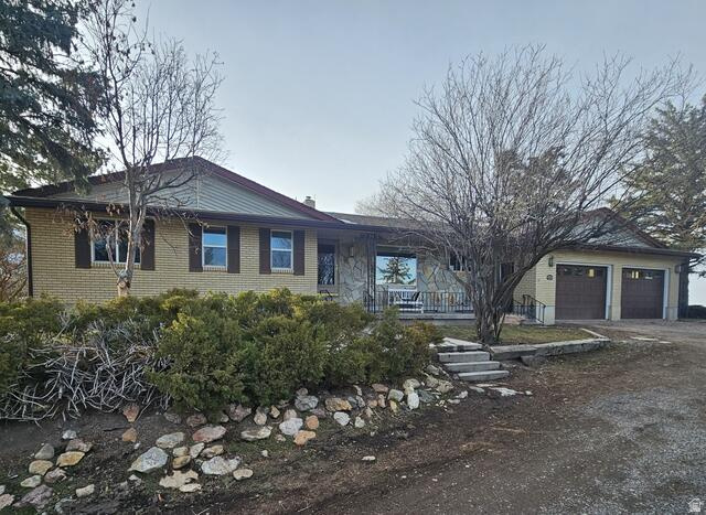 A Rare Rural Retreat - Space, Self-Sufficiency & Stunning Views 6 Acres | 3,600 Sq Ft | 5 Bed | 3 Bath | 2,600 Sq Ft Shop | Clifton, ID  Welcome to one of the most thoughtfully equipped rural properties on the market. Nestled on 6 fully fenced acres with sweeping panoramic views of the surrounding mountains and Oxford Reservoir, this exceptional home offers the privacy, preparedness, and wide-open space that so few properties can genuinely deliver. Whether you're a horse or livestock owner, a hobby farmer, or someone who values true self-sufficiency, this property was built - and upgraded - with purpose. The Home At 3,600 square feet, the 5-bedroom, 3-bathroom brick home offers generous living space across two levels, including a fully finished walk-out basement with apartment conversion potential - ideal for multi-generational living, rental income, or an additional retreat. Two wood-burning stoves on the main level and basement add warmth and reliability, while central air and forced-air heating keep every season comfortable. Built for Self-Sufficiency This property goes far beyond the average rural home. A whole-home solar system paired with a dual-fuel backup generator means the lights stay on. A 1,000-gallon owned propane tank, 120-gallon basement water retention storage, whole-house water softener with reverse-osmosis purification, dedicated food storage room, and a large root cellar make off-grid-ready living a genuine reality - not just an aspiration. For Your Animals & Your Work Two pastures and fencing across the full 6 acres provide ample, secure space for horses, cattle, or other livestock. A massive 3-bay shop (approx. 2,600 sq ft) with a loft and dedicated tack shed handles every project and every piece of equipment. Two Richie automatic waterers serve your animals with ease, and a sweeping circular driveway adds both function and curb appeal. The Setting Private, quiet, and jaw-droppingly beautiful - this property offers views in every direction, with the Oxford Reservoir as a stunning centerpiece. Yet it's far from isolated: you're just 15 minutes from the highly regarded West Side School District, 20 minutes to Preston, and within 45 minutes of both Pocatello, ID and Logan, UT.  Properties like this don't come along often. If you've been searching for space to breathe, land to work, and a home built to last - this is it. Serious and pre-approved buyers only. Showings by appointment.
