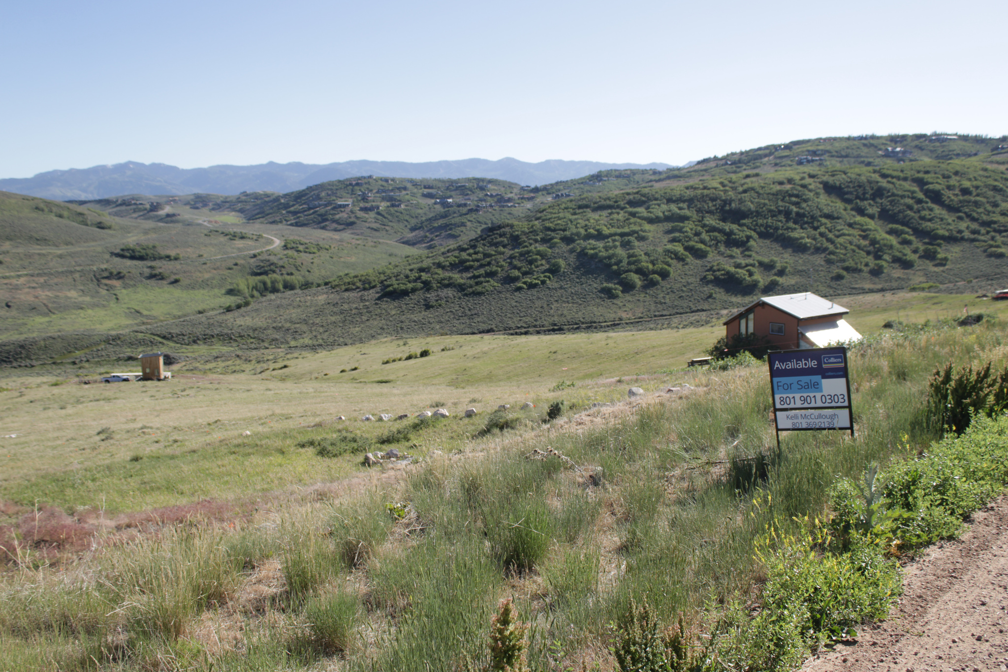 Enjoy stunning mountain and valley views from this scenic homesite. Water is through the HOA company. There is a water line to the lot but no connections available at the moment. This offers buyers the opportunity to purchase ahead of water availability at a discounted price. The HOA is actively drilling for additional water sources. Due to seasonal water service, many homeowners utilize water holding tanks during the winter months. Roads within the community are maintained and plowed during winter by homeowners and local volunteers.