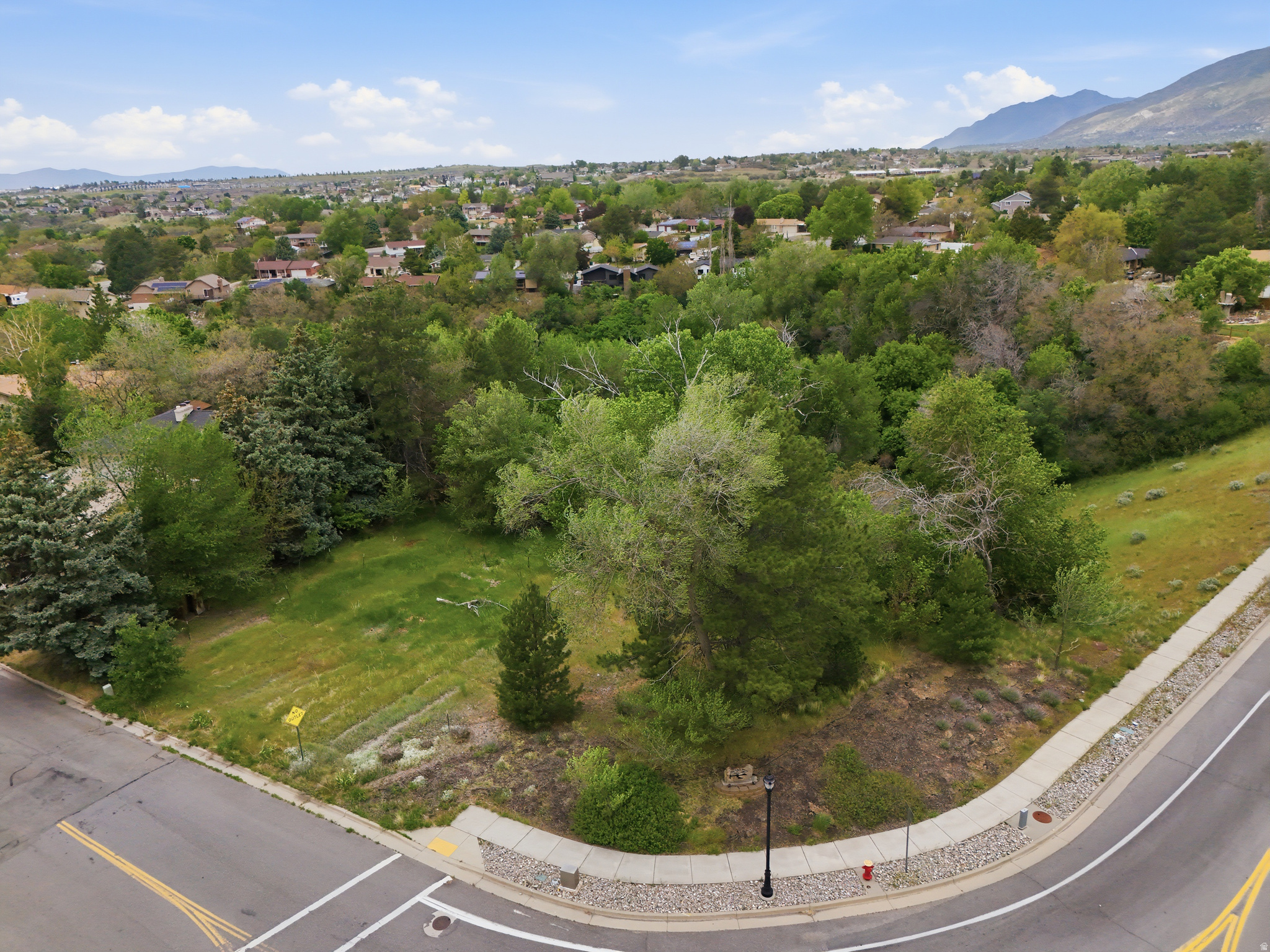 Layton .65-acre corner lot available. This sale includes two parcels: 09-071-0002 and 09-071-0001. This property is owned by the Utah Department of Transportation (UDOT). Please read all remarks carefully. UDOT requires all offers to be submitted on the UDOT legally authorized Real Estate Purchase Contract attached to this listing. Do not use the standard REPC. Please also review the attached Quit Claim Deed. All offers must include a pre-approval letter or proof of funds. When submitting an offer, include the buyer's down payment amount and loan amount in the email. The property is being sold AS-IS. Buyers may conduct their own due diligence during the due diligence period. No seller disclosures will be provided. Property boundaries are estimates only; buyers are advised to obtain an independent survey. UDOT cannot contribute toward buyer closing costs or any other concessions. Please allow 310 business days for a response from UDOT. If multiple offers are received, UDOT will not request highest and best offers. The net offer will be used in evaluating all offers.
