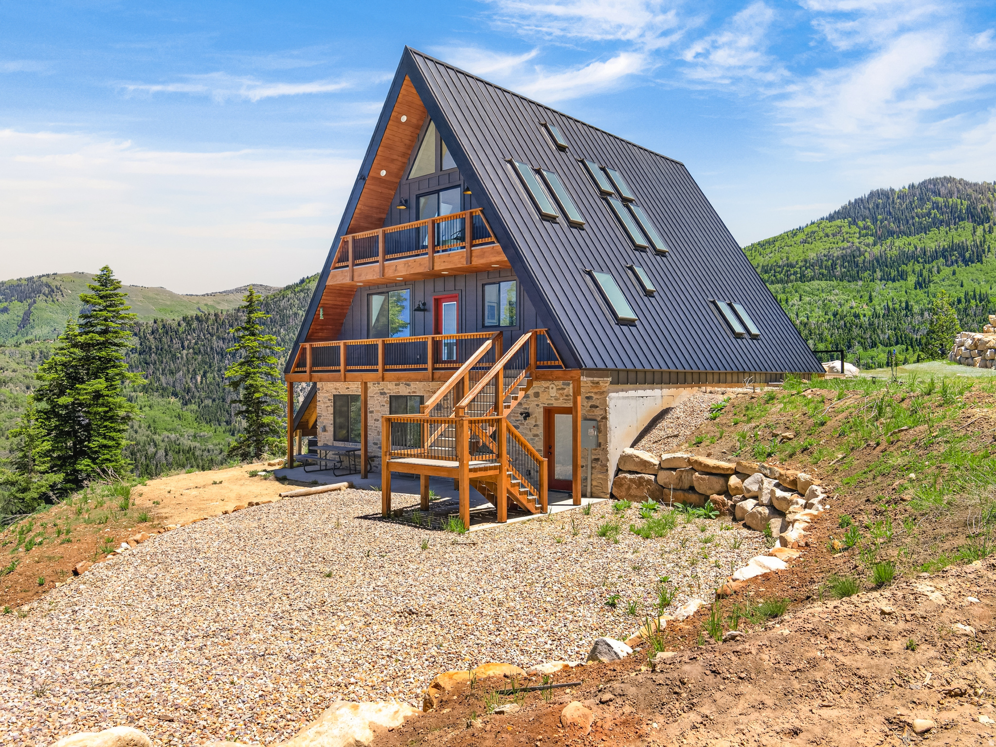 Enjoy exclusive access to Skyline Drive a rare perk that is difficult to come by in this area! Pine and aspen trees with stunning panoramic mountain vistas of the protected Manti-LaSal national forest, ensuring your views will remain untouched forever. This gorgeous custom-designed luxury A-frame cabin is a masterpiece of architecture and natural harmony which offers a lifestyle that combines elegance, adventure, and serenity. Whether you're on the main floor, second floor or on the expansive front deck, watch the sunrise over majestic mountain peaks, casting a golden glow on the valley below. You'll forever appreciate the amazing views. Designed with skylights allowing in plenty of natural light, even skylights over your bed for nighttime star gazing! Escape to the mountains and enjoy your very own premium 6.7 acre private mountain retreat. Southeast of Mt Pleasant, Utah this property is the perfect distance from the Wasatch Front. Far enough away to bask in quiet privacy, and close enough for a day trip. At the heart of the home is a breathtaking great room with soaring 30-foot cathedral ceilings, clad in exquisite wood tongue-and-groove. The result is a stunning and inviting sanctuary, bathed in natural light and perfectly framing the uninterrupted views of the mountains and the valley below. Your neighbors are the abundant wildlife with endangered snowshoe hares, eagles, elk, deer and wild turkeys to keep you company. The cabin's meticulous design features only the finest finishes, including a stunning waterfall marble island in the kitchen, complemented by high-end stainless steel smart appliances. A top-tier wood stove anchors the great room, offering both warmth and charm. Modern comforts like a full HVAC system and an on-demand water heater ensure your year-round comfort. With strong Wi-Fi and mobile service, the cabin is perfect for remote management or seamless connectivity when you're on-site. Outdoor living is a dream, with Trex decks providing a maintenance-free space to take in the breathtaking surroundings. The location also offers easy access to Skyline Drive, an outdoor enthusiast's paradise with endless miles of pristine alpine wilderness. Families will love exploring nearby Potters Pond and other alpine lakes, perfect for fishing and endless recreational opportunities to make lifelong memories. For a touch of small-town charm, the nearby towns of Mount Pleasant and Spring City are a quick drive away. Enjoy the nostalgic experience of a drive-in movie, savor homemade ice cream, browse the many local thrift shops or visit the indoor rec pool, grocery and hardware stores . For peace of mind, a hospital and emergency services are just 15 minutes away, ensuring safety and convenience for your family. Adding to the allure of this property is a geodesic dome nestled among the trees. This unique feature offers endless possibilities, whether used as a guest suite, a children's hideaway, or a tranquil retreat. The dome is fully insulated, equipped with a wood-burning stove, and conveniently located near a water hydrant. Rocky Mountain power, gas is propane with DSL internet available. Winter access is by tracked vehicle only. MLS map is correct. Google Maps/Earth is 39.46947, -111.39727. Elevation is 8,300 feet. Buyer to verify all information and square footage.