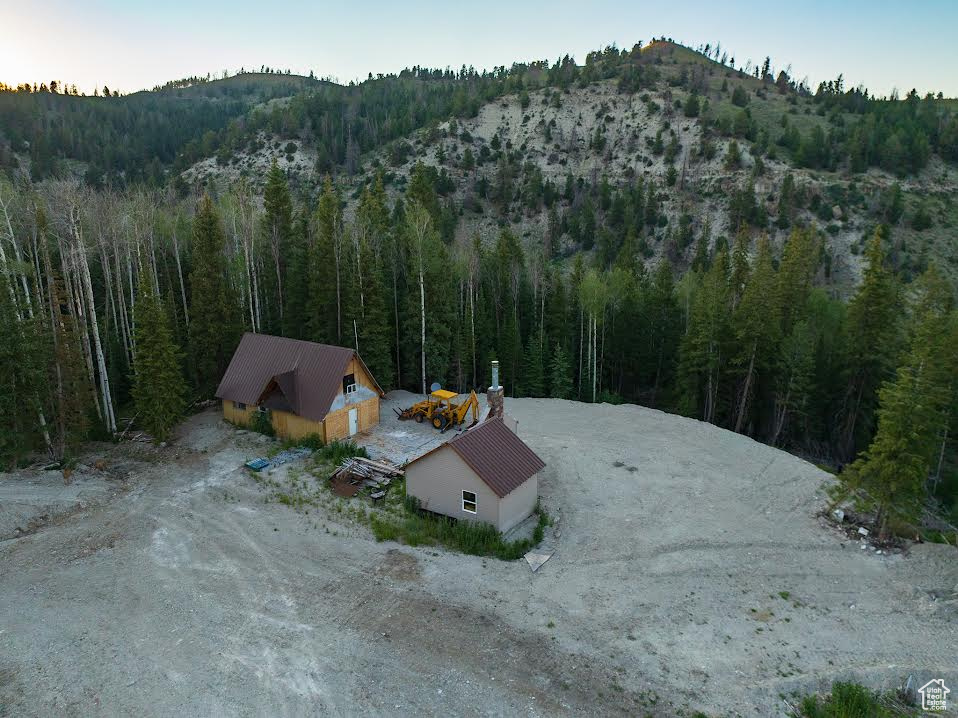 Creekfront PLUS a Spring!!!  2 off grid cabins for the price of one!! 10 acres with pines and quakies at 8800 feet elevation!  Part of the property has been cleared for fire break and allows lots of space for your family's camp trailers and RV's, boats, etc!!!  The cabins are small, but functional for lots of people! The main cabin has a crawl space and has 2  bedrooms, bath, living room, and a large upstairs loft. The 2nd cabin is 247 square feet and is an open floor plan.  The spring is a legal water right.  Water is plumbed from the spring to the water tanks and then gravity fed back to the cabin.  The overflow is plumbed to the potential pond.  The cabin has been wired to a spot for a potential garage that would house the solar panels and generator. The property is about 3 miles from the pavement, just past Bear Claw!  Includes 2 tax parcel ID #'s.   00-0011-2213, and 00-0011-4235  Buyer to verify all information.  All potential buyers must be accompanied by an agent.