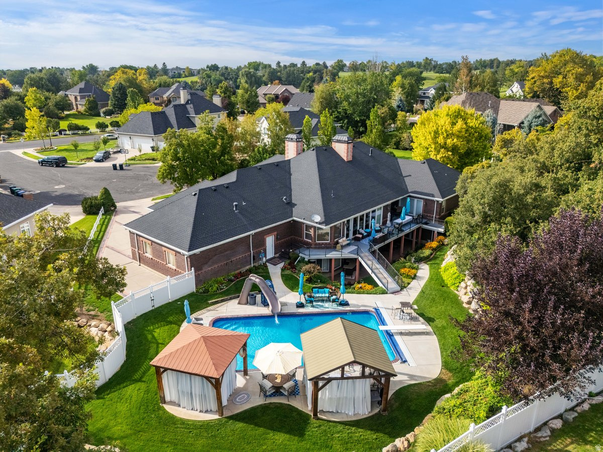 This remarkable 7,305 sq. ft. all-brick custom home offers elegance, comfort, and privacy in one package. Perfectly situated on a .73-acre secluded lot, this property is designed for both entertaining and everyday living. Inside, you'll find an open and inviting floor plan highlighted on the main floor by a huge master retreat, formal living room, den, gourmet kitchen with a Wolf range, Sub Zero fridge, and warming oven The walkout basement provides additional entertaining space, abundant storage, craft room, kids wonderland and direct access to the backyard oasis. Step outside to enjoy the sparkling saltwater pool, perfect for summer gatherings or quiet relaxation. A spacious 3-car garage with direct access to basement and backyard ensures plenty of parking and storage. This home has been meticulously maintained with recent updates including a new roof, rain gutters, furnaces, pool liner, and water heaters-providing peace of mind for years to come. With timeless construction, modern updates, and a private setting, this property is truly one-of-a-kind.