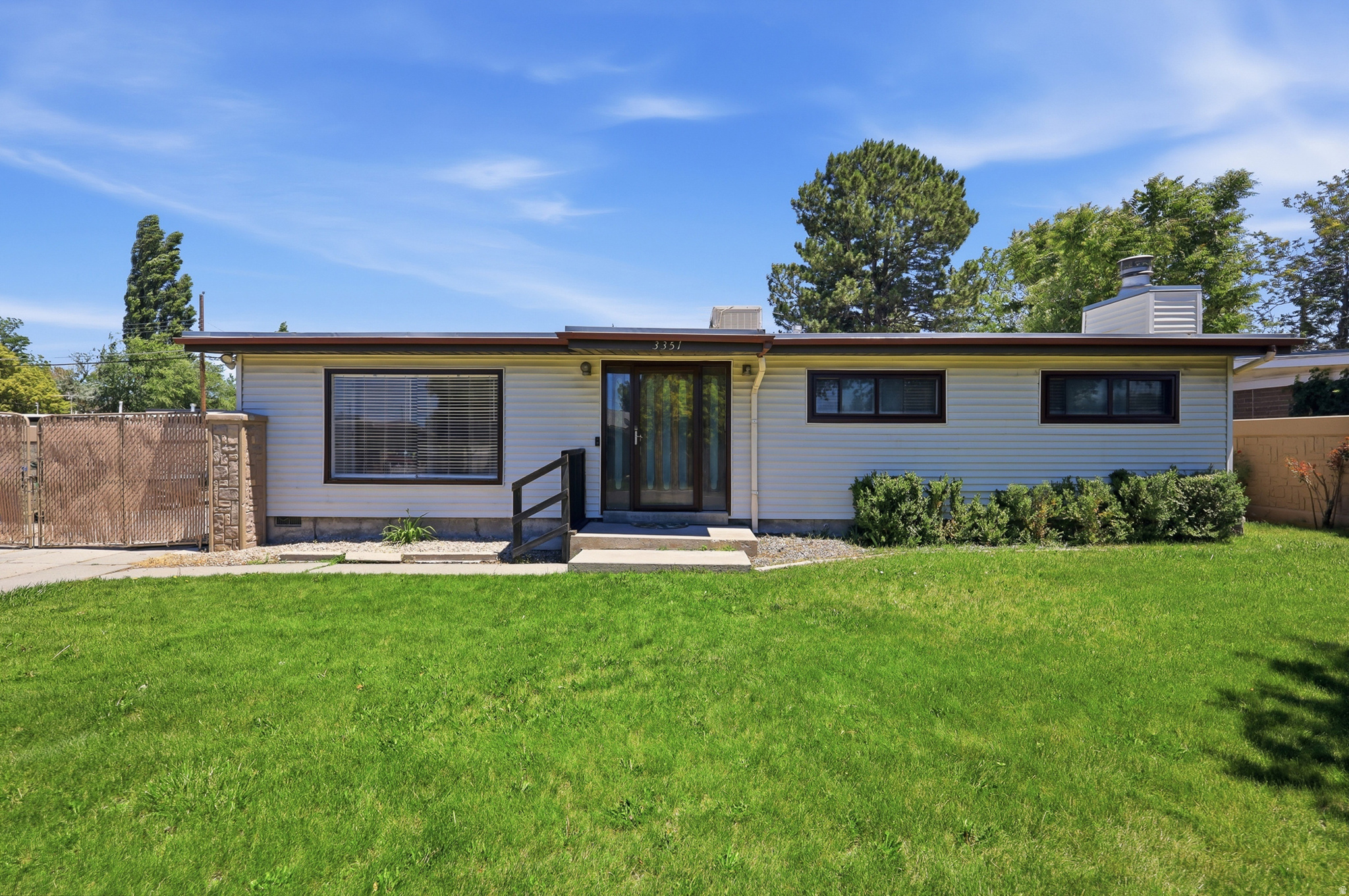 Welcome home to this charming one level living rambler featuring 4 bedrooms, 2.5 bathrooms, and a comfortable open layout that makes the home feel warm and inviting. With two fireplaces, there is plenty of cozy living space to enjoy year-round. One of the standout features of this property is the custom concrete privacy fence, offering a rare combination of privacy, security, and long-lasting durability. The mature landscaping and secluded backyard create a peaceful retreat, while the large covered patio is perfect for relaxing, entertaining, or enjoying quiet evenings outdoors. Two storage sheds provide great space for tools, hobbies, or outdoor equipment. This home offers timeless charm, functional living space, and a backyard designed to feel private and protected.