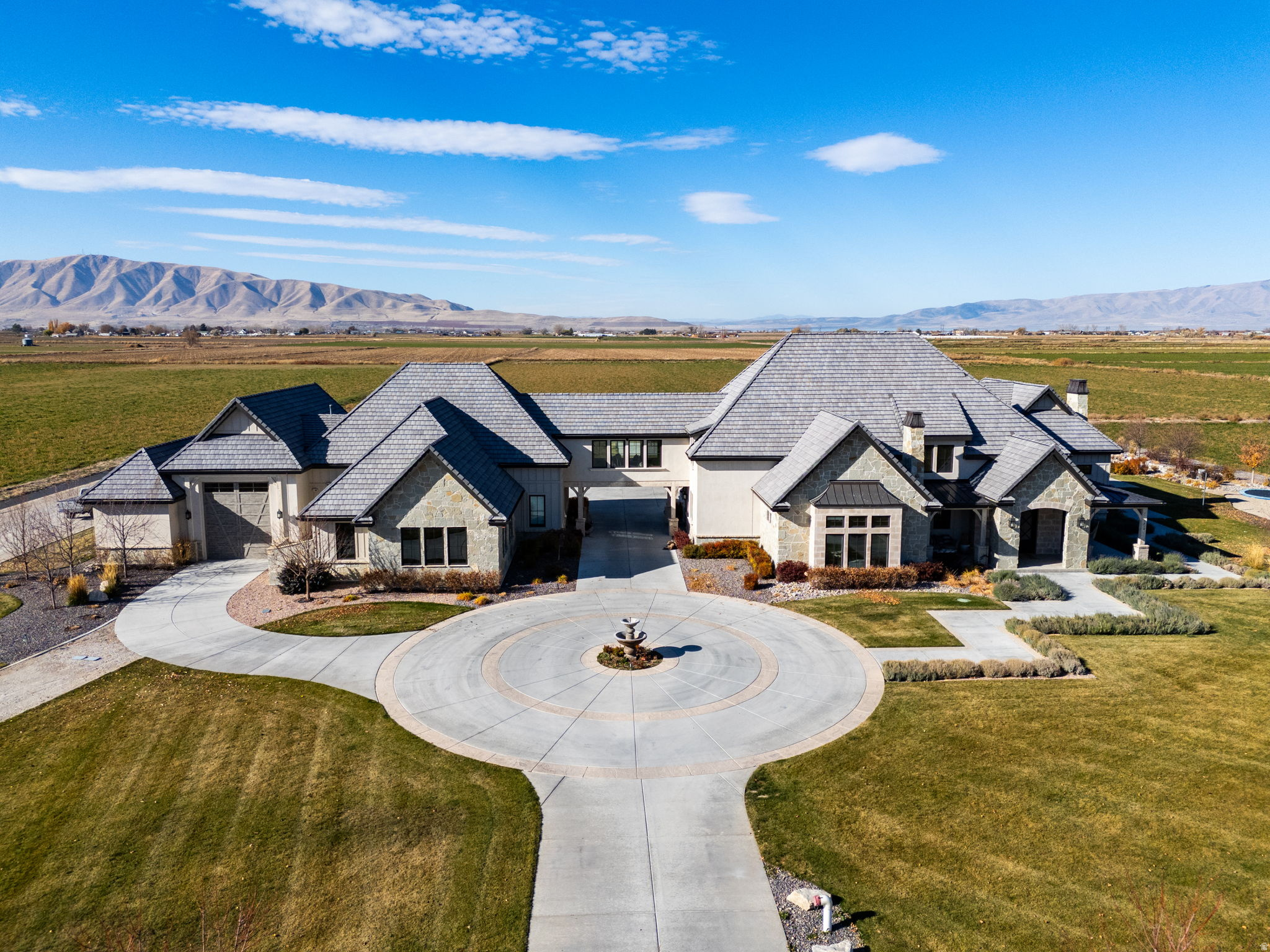 SELLER FINANCE: 20% down. Interest Rate is negotiable. Experience unmatched luxury living in the heart of Spanish Fork, Utah with this extraordinary custom estate, showcased in the 2020 Parade of Homes. Designed for comfort, technology, and recreation, this home offers fully automated Control4 systems, automated blinds, whole-house audio across 15 zones, Starlink internet, and a backup generator with solar power. The main-level primary suite features radiant heat, a private sauna, secure storage, and consistent climate control throughout the home. Entertainment spaces include a theater with Kaleidescape true-4K/Atmos, an Xbox room, "kid cave," upstairs laundry, and a dedicated media closet. Step outside to a stunning backyard oasis featuring a saltwater pool with retractable cover, hot tub, outdoor shower, and plumbing for a balcony slide. The property includes artesian well water flowing to a 70,000-gallon tank used for landscaping, extensive water rights, septic, natural gas service, and a heated driveway. A massive pull-through RV garage with sewer dump, batting cage/shooting range rated up to .50 caliber, mancave above the garage, and air-hose hookups add true versatility. An exceptional Spanish Fork property offering unmatched features, privacy, and recreation access. Measurements provided as a courtesy only. Buyer to verify all information.
