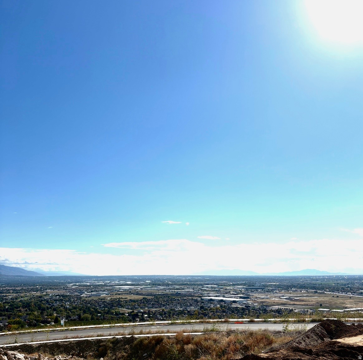 Nestled High on the Beautiful Pleasant View Bench, this stunning 0.40-Acre lot showcases sweeping Mountain and valley views along with breathtaking sunsets. The property offers the perfect setting for a custom home designed to highlight the area's natural beauty and serene surroundings. Enjoy the peaceful atmosphere while being just minutes away from hiking trails, skiing, parks, and local conveniences. this rare view lot provides an exceptional opportunity to build your dream home in one of Pleasant View's most desirable locations.