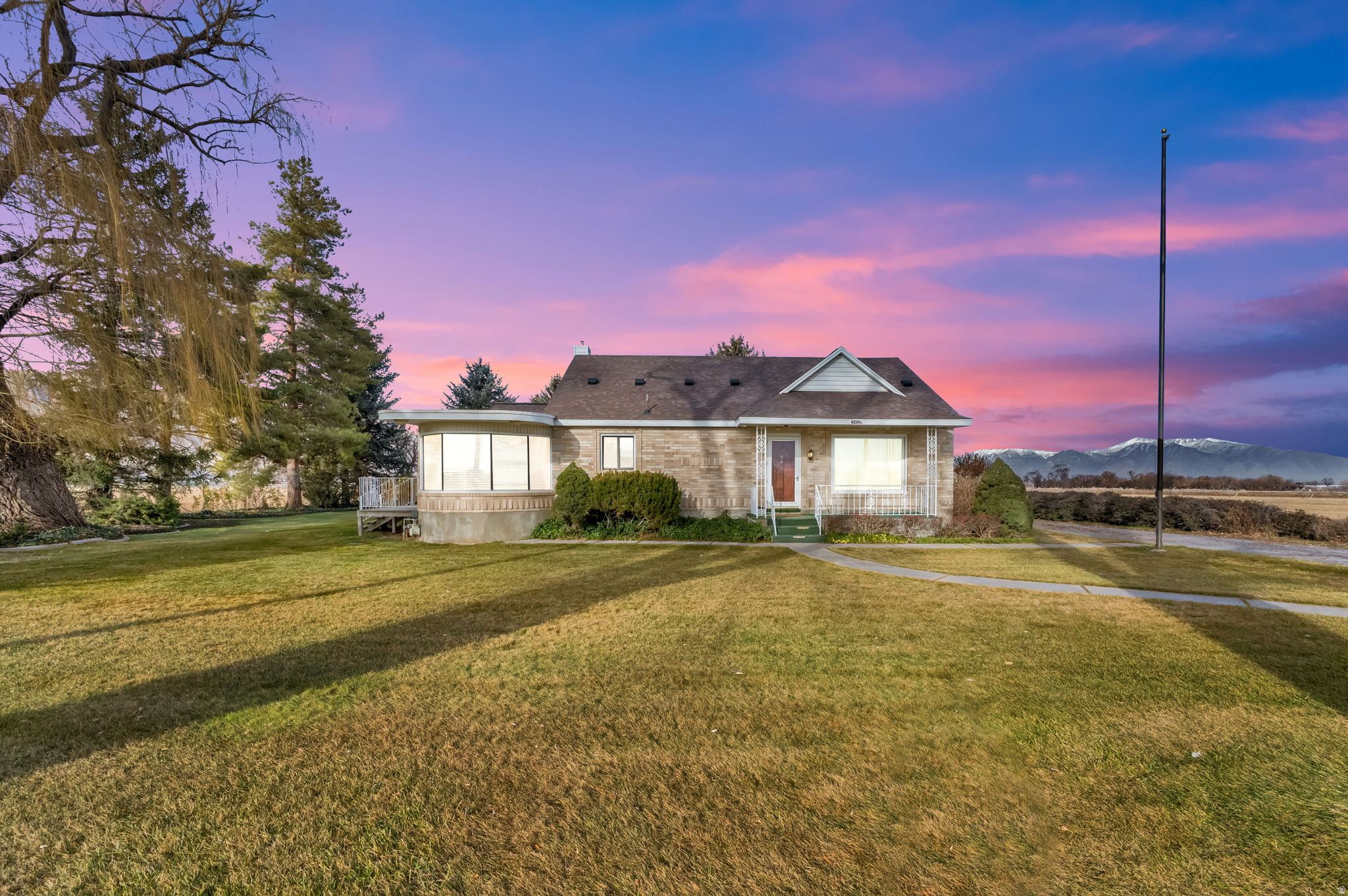 JUST REDUCED! Escape to your own private slice of Country Paradise on West Mountain in Payson! Nestled on 5.25 acres of scenic, open land, this beautiful property features a charming brick 4-bedroom home with timeless appeal and plenty of room for your dreams to grow. Enjoy breathtaking mountain views, wide-open space for animals, recreation, or future possibilities, and the peace and quiet of rural living-all just minutes from town. Whether you're looking for a hobby farm, a place to build your dream lifestyle, or simply more space to breathe, this rare gem truly has it all. The home has been thoughtfully updated with new windows, updated bathroom (2022), updated plumbing and electrical, a newer roof (2020), a new well pump, and a new septic drain field-giving you both comfort and peace of mind. Please note: The home and 5.25 acres are being sold separately from the additional 33.66 acres located west of the property, though all 38.9 acres may be purchased together. Home is being sold as-is as it's being sold as an estate sale. Buyer and buyer's broker to verify all square footage and listing information.