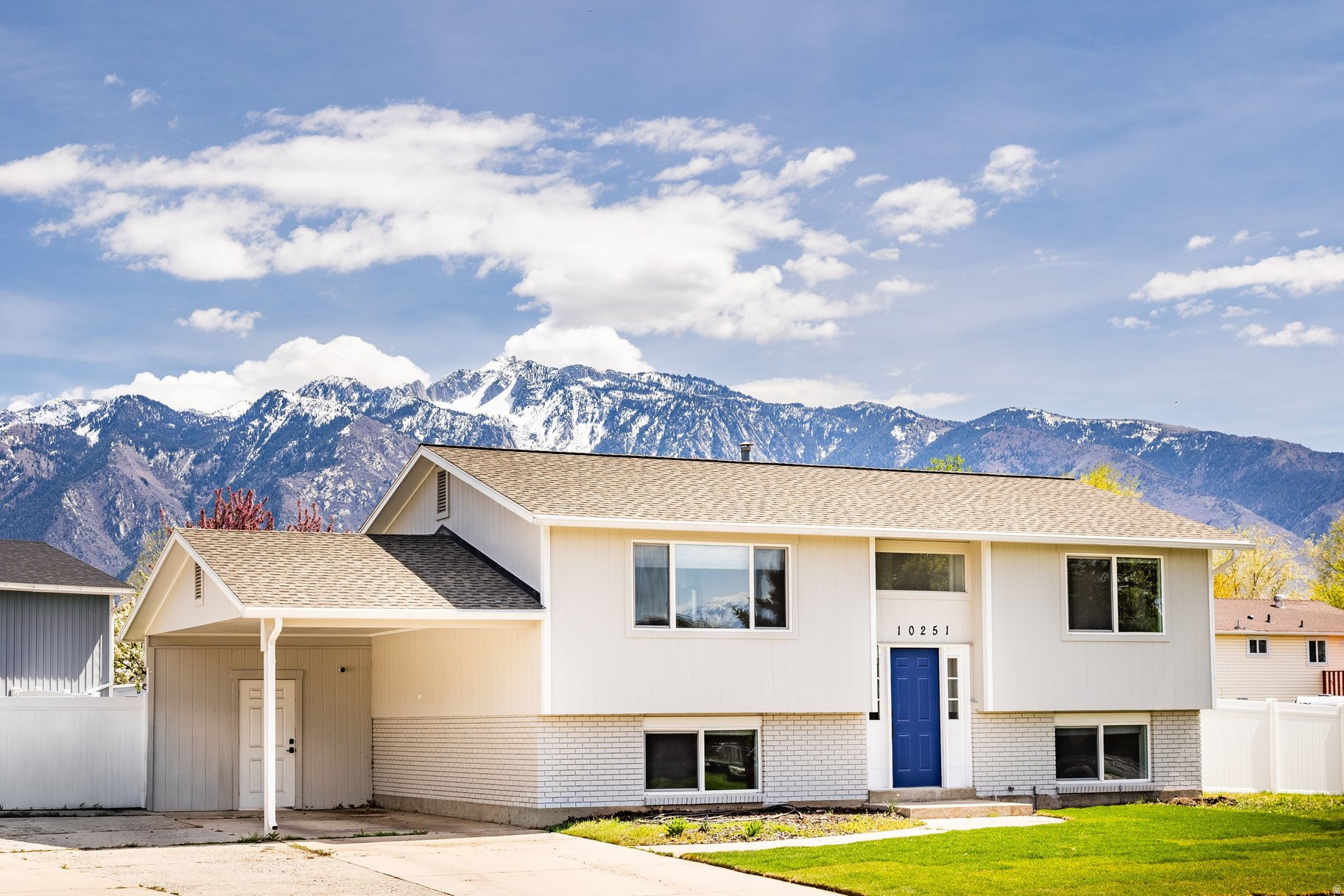 Welcome to this beautifully remodeled home in the heart of Sandy, where thoughtful design meets everyday comfort-set against breathtaking views of the Wasatch Mountains. Featuring four spacious bedrooms and two fully updated bathrooms, this home offers a seamless blend of style and functionality. The stunning new kitchen is a true centerpiece, complete with quartz countertops, custom cabinetry, and brand-new stainless steel appliances-perfect for both entertaining and daily living. Throughout the home, you'll find new LVP flooring, plush carpet, fresh interior and exterior paint, and updated baseboards that create a cohesive, modern feel. Both bathrooms have been completely renovated with custom vanities, updated fixtures, and a beautifully tiled shower surround. Major system upgrades including a newer A/C, new water heater, and new windows provide peace of mind and energy efficiency. Step outside to a beautifully landscaped yard-ideal for relaxing, entertaining, or simply taking in the incredible mountain views. Located in a highly desirable, central Sandy neighborhood, you're just minutes from shopping, dining, parks, schools, and world-class ski resorts. This is a turnkey home you won't want to miss.