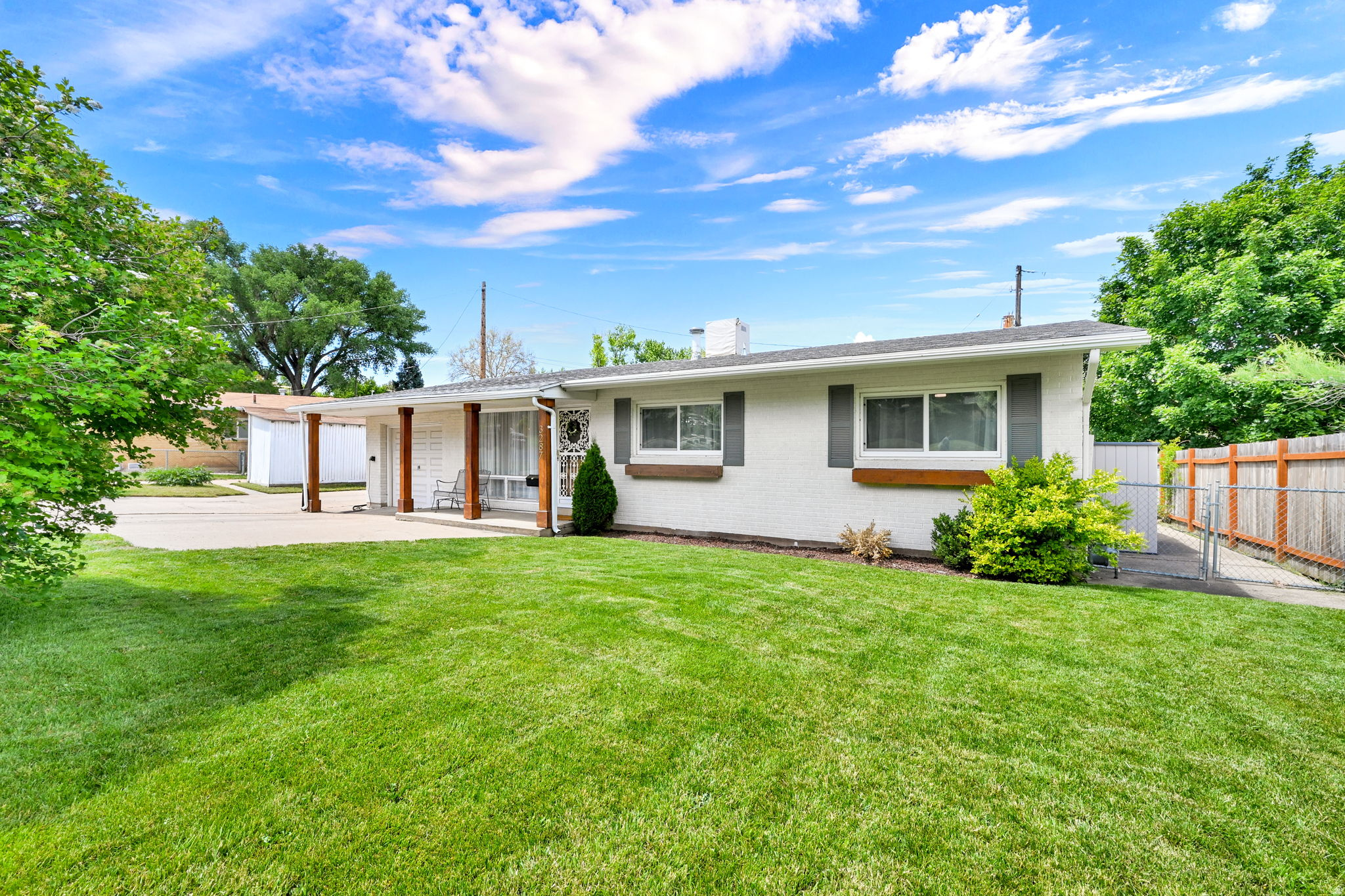 Charming home on a quiet street. Gorgeous original wood floors, open layout, fully fenced yard with new deck. Extra deep garage with storage shelves, new windows & new roof.