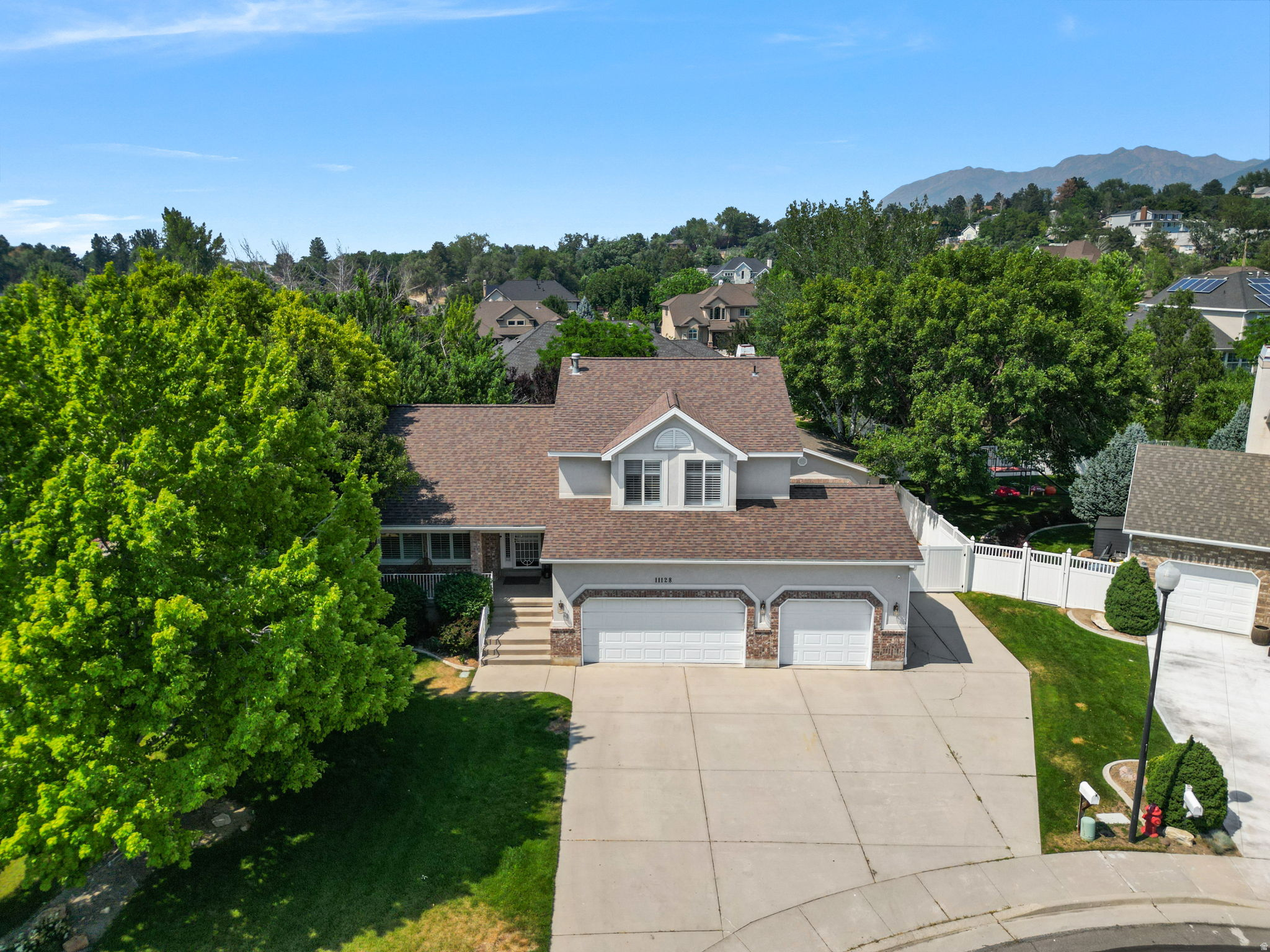 Wyngate Estates Gem with Mountain Views, Private Gym & Exceptional Garage Space! Nestled on a quiet cul-de-sac in sought-after Wyngate Estates, with breathtaking views of Lone Peak and the Wasatch Front, this spacious contemporary home offers the perfect blend of comfort, style, and functionality. Soaring ceilings and abundant natural light create an inviting atmosphere throughout, while the home's modern feel provides a welcoming space designed for both everyday living and entertaining. The thoughtfully designed floor plan features multiple gathering areas, a formal dining room just off the kitchen, and a spacious eat-in kitchen complete with a large island that's ideal for meal prep, casual dining, or hosting family and friends. With plenty of room to spread out, everyone can enjoy their own space while still staying connected. For those who prioritize health and wellness, the home includes a dedicated private gym, making it easy to maintain an active lifestyle without ever leaving home. Whether you're fitting in a morning workout, strength training session, or yoga practice, this flexible space supports your wellness goals year-round. Situated on nearly one-third of an acre, the outdoor spaces are just as impressive. Enjoy your mornings from the welcoming front porch while taking in stunning mountain views, or step outside onto your private covered back deck were you can create your own private sanctuary. Surrounded by mature landscaping that enhances both beauty and privacy, the backyard offers a peaceful setting for relaxing, entertaining, gardening, or simply enjoying the tranquility of your surroundings. A standout feature of the property is the climate-controlled, insulated detached two-car garage in addition to the attached three-car garage. Perfect for a workshop, hobby space, extra storage, or year-round recreation, this versatile addition offers endless possibilities. Located just minutes from Little Cottonwood Canyon, this exceptional home offers the perfect blend of privacy, convenience, and adventure. Enjoy breathtaking mountain views, generous living spaces, and easy access to world-class skiing, hiking, biking, and endless outdoor recreation. With popular dining, shopping, and everyday amenities just 1015 minutes away, this is a rare opportunity to experience the lifestyle that makes living along the Wasatch Front so desirable.