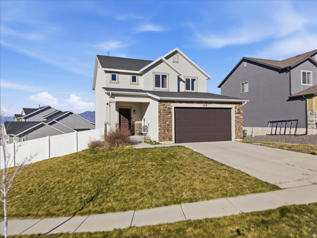 Beautiful two-story home in a fantastic Elk Ridge location offering space, flexibility, and incredible functionality! This 5-bedroom, 4-bath home features a convenient main-level primary suite along with bright, open living spaces designed for comfortable everyday living. Upstairs includes three additional bedrooms, a full bath, and a versatile loft area perfect for a family room, office, or play space. The recently finished basement expands the possibilities with a second kitchen, additional laundry area, and walkout access to the backyard through a private side-gate entrance - ideal for guests, multi-generational living, or potential rental income. Located in a wonderful neighborhood with room to live, work, entertain, and grow, this home is now offered at an exciting new price!