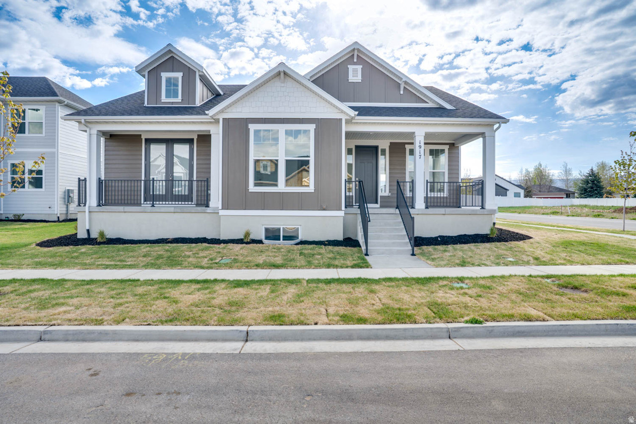 This brand new home was just completed and move-in ready!  SALES EVENT**Builder is offering $26,970 when using our preferred lender** The Willow is a masterfully designed home that embraces both elegance and functionality, offering a seamless blend of open-concept living and thoughtful details.  With main floor living at its core, this exquisite residence features an inviting, light-filled layout that effortlessly connects the kitchen, dining, and living areas; perfect for both intimate gatherings and grand entertaining.  A chef-inspired kitchen, complete with an oversized pantry, provides ample storage and convenience, while the spacious great room invites relaxation and connection.  The primary suite is a private sanctuary, boasting generous proportions, and exclusive access to a serene covered porch-an idyllic retreat to enjoy morning coffee or unwind under the evening sky.  A second covered porch at the front enhances the home's architectural charm, offering an inviting space to welcome guests.  For those seeking future expansion, the expansive unfinished lower level presents boundless possibilities.  Designed to accommodate up to three additional bedrooms, two bathrooms, and a sprawling family room, this space is ready to be transformed into the ultimate haven for entertainment, guest accommodations, or multi-generational living.