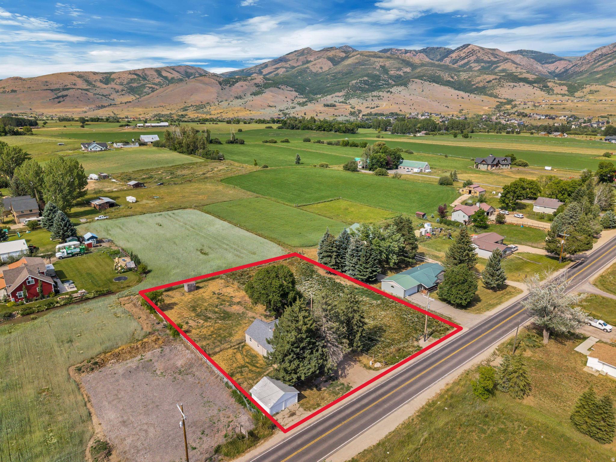 Rare chance to own nearly an acre in the heart of the Ogden Valley. This 0.87-acre parcel at 3342 E 4100 N in Eden features a single-story home with a brand new water heater, plus outbuildings, zoned AV-3 Agricultural Valley - a grandfathered residential lot that allows the existing home to be maintained, remodeled, or expanded. Zoning also permits an accessory dwelling unit (ADU), new garage/barn/shop, home occupation, horses (1 per  acre), and family food production - ideal as a rural retreat, remodel project, or long-term hold. Includes 1 share of Liberty Pipeline Company for culinary water, which transfers to buyer at closing. Property lies within the Liberty Irrigation Association secondary water system. Minutes to Powder Mountain, Nordic Valley, Snowbasin, and Pineview Reservoir. Property is sold as-is. Buyer to verify all zoning, rebuild rights, permitted uses, and water with Ogden Valley City and applicable water companies.