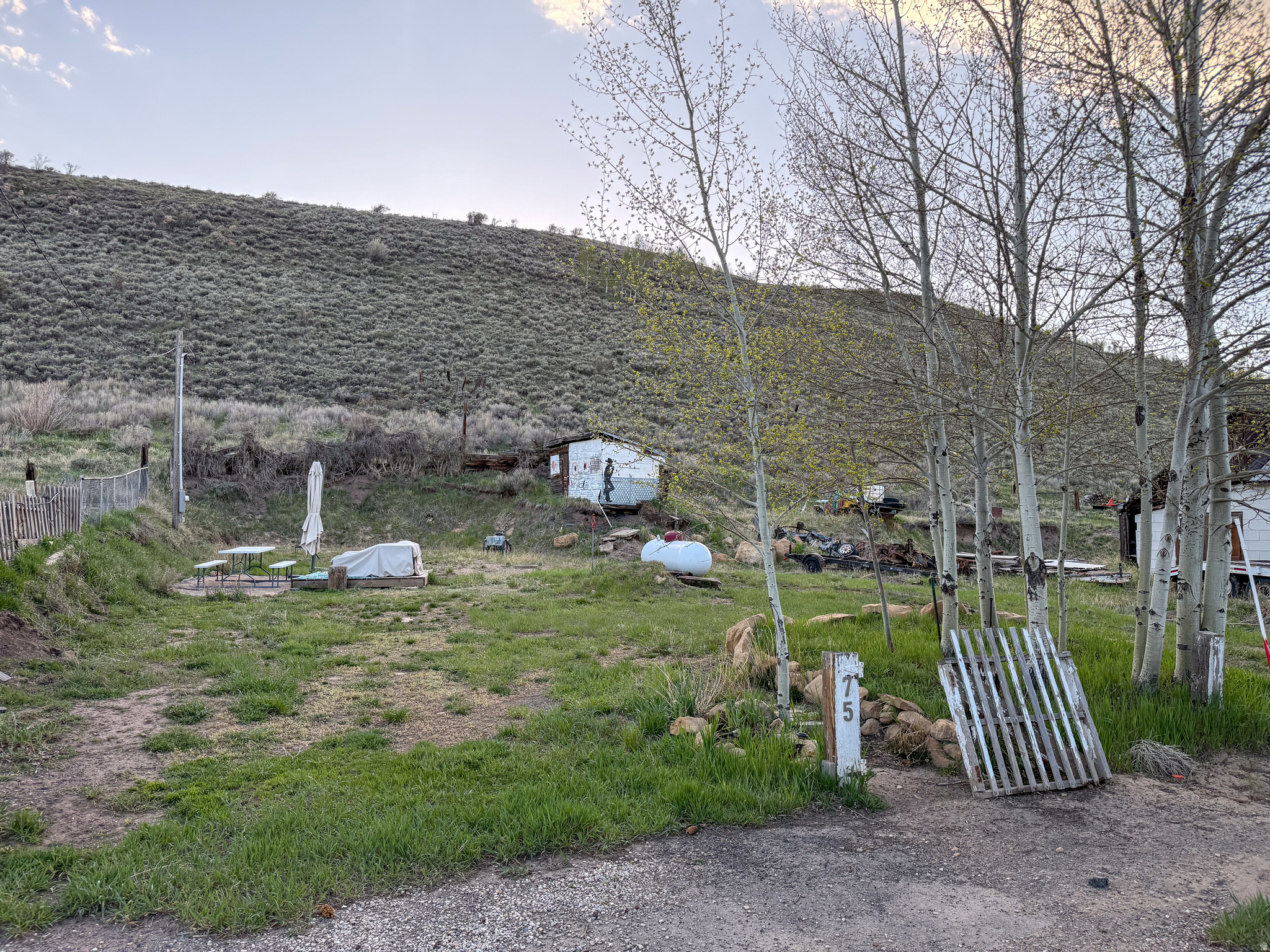There are a lot of people looking for a place in the mountains without an HOA, where they can put a camp trailer on it for the summer and enjoy it to their heart's content. If you're one of those people, I have a place for you! It is a .14-acre parcel with a few mature quakies on it, a power drop, sewer connection, a water connection, and a tank full of propane. There's also a deck with outdoor furniture on it! But don't stop at the RV, go ahead and build a summer home instead! Either way you go, it's the perfect place to kick back and relax in the mountains at Scofield.   Square footage figures are provided as a courtesy estimate only and were obtained from county records.  Buyer is advised to obtain an independent measurement.