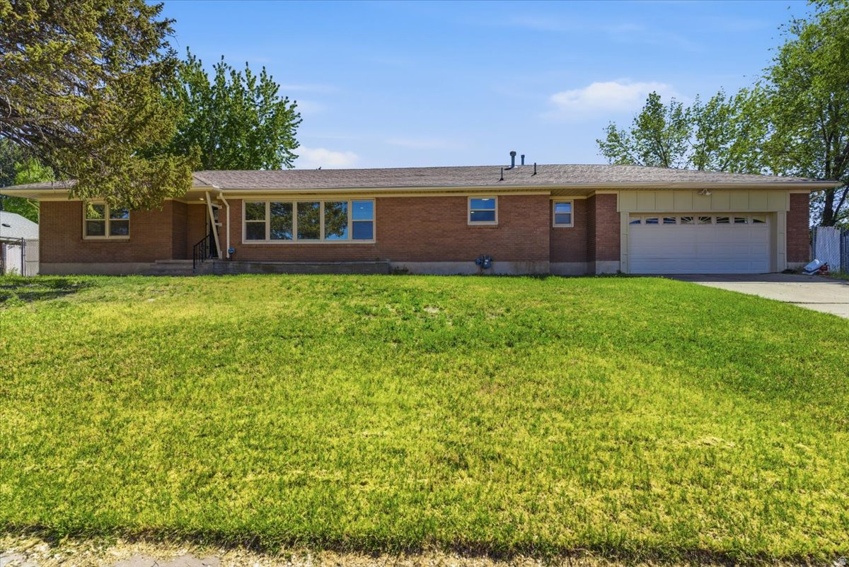 This beautifully updated rambler home blends modern style with everyday comfort in a bright, open layout. This all brick home offers a fully remodeled kitchen featuring stainless steel appliances, tile backsplash, granite countertops and a spacious island perfect for cooking, dining, and entertaining. The home flows seamlessly into a large, light-filled living area with expansive front windows that bring in abundant natural light and create a warm, inviting atmosphere. Contemporary finishes throughout including an electric fireplace, updated flooring, recessed lighting, and clean, neutral tones that make it easy to personalize and feel at home right away. Enjoy the unfinished basement that allows for full creative control on how to make that space exactly what you want. Located on .31 acres, this home is just minutes to the 1-15 freeway access, shopping, dining, etc. Don't miss out on this move-in-ready home that offers the perfect balance of charm and modern living!