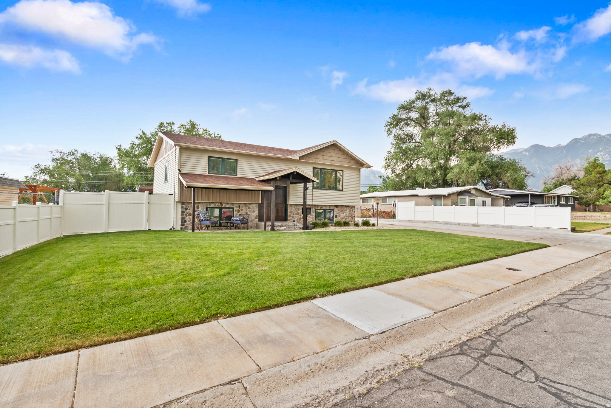 This spacious two-story home offers a luxury primary suite upstairs with 1 bedroom and 1.5 baths, plus a mother-in-law basement apartment featuring 2 bedrooms, 1 bath, and its own separate kitchen and laundry, which can be perfect for multi-generational living or rental income. A massive 22' x 46' two-story garage/workshop sits separately on the property, built for serious projects and storage. With a 4-car main level, a full second floor for a man cave, gym, or workshop space, and 20-ft ceilings that give it real shop-grade clearance, this is a space made to work as hard as you do.  The mother-in-law apartment offers $1,700/month in rental income potential, ideal for offsetting your mortgage, hosting guests, or extended family.  General property features include a large storage shed, raised garden beds with a drip system, a hot tub, and RV parking. Water and sewer are also plumbed on the garage's lower level for added flexibility.  Located on the desirable East Bench near schools, shopping, and outdoor recreation, with easy access to the gully's hiking and horse trails -  just 3 miles to the canyon.  The entire home was updated in 2019, including a new roof, HVAC system, high-efficiency tankless water heater, water softener, and a new sewer line from the home to the city road. Also new: electrical wiring, plumbing, upgraded fixtures, and fresh paint throughout. Square footage figures are provided as a courtesy estimate only and were obtained from county records . Buyer is advised to obtain an independent measurement.