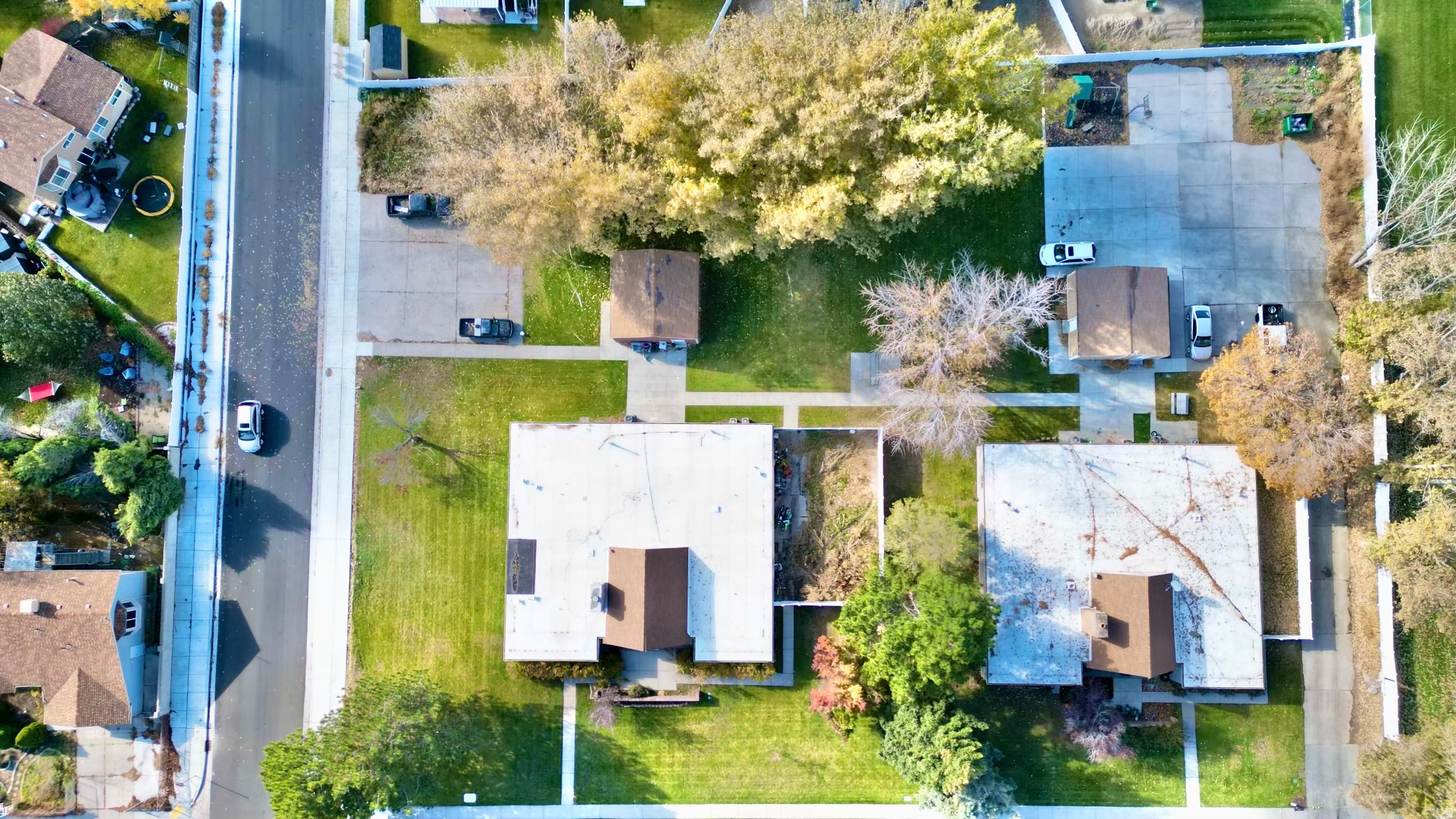 This unique 1.44 acre property was originally built and used as a residential treatment facility. There are 2 large homes (4510 sq/ft each) plus 2 extra large storage buildings that have basements! Two combined homes  have recently been updated into 6 rentable multi-family units, yet still have preserved main living area's mid-century modern feel, as this was designed by world famous architect Ron Molen! There is so much opportunity here with Olympic Size Possibilities! The property could continue as an income producing multi-family investment, or revert back to being used as a residential treatment facility non-profit. Or possible rezoning for a developer's dream of a Mixed Use Development and/or housing for athletes training at the Kearns Ice Oval located next door!  Kearns Council has been open to discussing ideas of mixed use/commercial development projects to align with the city's goals of improvements and visions with the upcoming 2034 Utah Winter Olympics and the close proximity of the Ice Oval & South Valley Regional Airport.  The timing for this opportunity could not be better! Don't let it slip away!