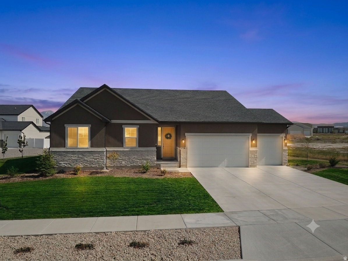 Built in 2022 on a premium 0.5-acre lot, this 4,790 sq. ft. residence offers an all-inclusive living experience. From the professionally finished Basement to the mature, productive landscape, every detail of this 4-bedroom, 4.5-bathroom home has been completed for immediate enjoyment.   The "Move-In Ready" Advantage This property stands out for its comprehensive level of finish, featuring several high-value assets that are typically added after a move:  Fully Finished Lower Level: The expansive basement is finished and includes a large family room, providing immediate square footage for a home theater, gym, or additional guest quarters.  Pre-Installed Interior Comforts: Custom window blinds are already installed throughout the home, and a professional radon mitigation system is fully operational.  Professional Culinary Kitchen: Designed for high-capacity entertaining with double ovens, an open-concept layout, and an included stainless steel refrigerator.   Established Productive Landscape & Utility The outdoor space is meticulously developed for both utility and recreation, offering established features that take years to grow:  Productive Fruit Trees: The yard features a variety of mature trees including 3 Cherry, 2 Nectaplum, 2 Peach, and 1 Almond tree.  Secondary Water Assets: Includes 1 irrigation share, a critical asset in the Tooele Valley for sustainable, low-cost maintenance of the half-acre lot.  Outdoor Infrastructure: Features raised garden beds and an expansive graveled parking area-ideally suited for large RVs, boat storage, or a future detached workshop.  Recreation Ready: The backyard is a dedicated space for yard games, BBQs, and gathering, set against the backdrop of Utah's scenic mountain ranges.   Grantsville Community & Lifestyle Data Education Hub: Phenomenal proximity to local schools-approximately 0.3 miles from Twenty Wells Elementary and a short drive to Grantsville High School.  Premier Recreation: Minutes from Grantsville Reservoir for fishing and boating, and the Clark Historic Farm, which hosts the community's heritage events and seasonal festivals.  Safety & Stability: Grantsville is recognized for its quiet neighborhoods and low crime rates, consistently ranking as one of the most family-friendly cities in Tooele County.  Commuter Access: Offers a peaceful, rural feel with an easy 35-minute commute to Salt Lake International Airport and the Downtown Salt Lake City business district.
