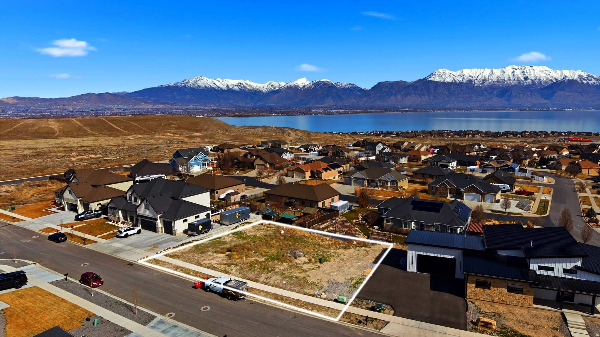 Located in the highly sought-after Jacobs Ranch subdivision, this spacious 0.27-acre lot offers stunning views of the mountains, valley, and Utah Lake. With all utilities stubbed and no HOA restrictions, it's the perfect site to create a custom home in a peaceful, established neighborhood. Just minutes from schools, parks, shopping, and hiking trails -opportunities like this are rare!