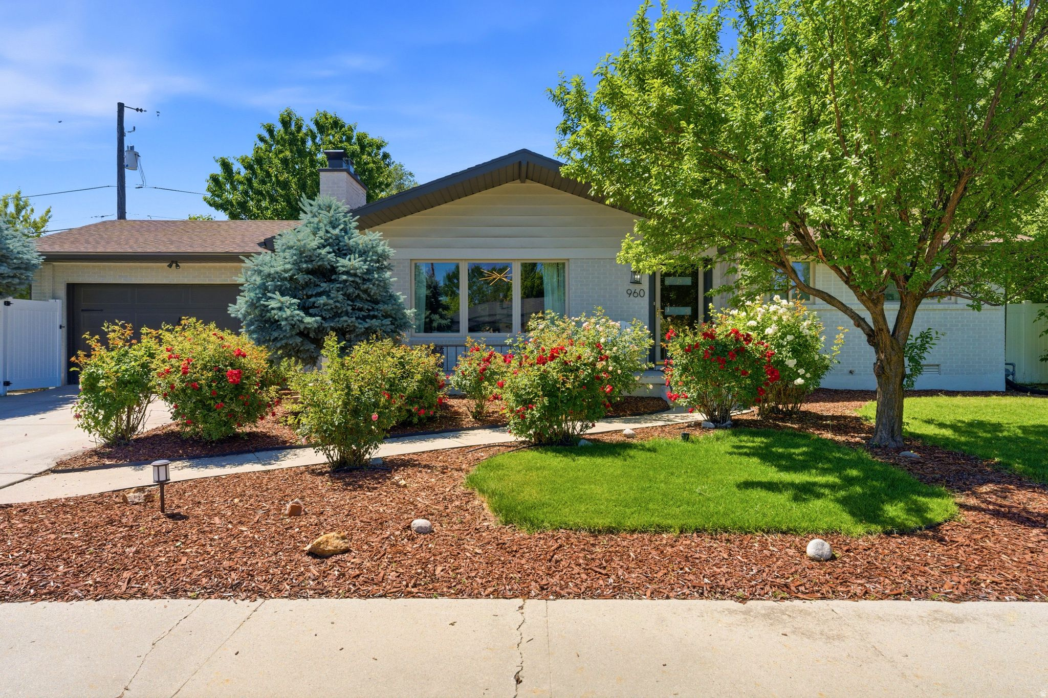 Welcome to quiet and turn-key living in this fully updated Millcreek home. Set in between the Millcreek Commons and the New Holladay Hills commercial Development and ideally situated in the Sagehill cul-de-sac. Thoughtfully designed with an, open floor plan, the residence features three bedrooms and three full bathrooms, ideal for both everyday living and entertaining. Complemented by custom cabinetry that adds warmth and sophistication at every turn - a rare opportunity to enjoy modern finishes, privacy, and timeless appeal in one of Millcreek's most desirable settings. Recent upgrades also include a new roof and gutters, upgraded plumbing and electrical, and a new water heater, newer furnace - in addition to numerous cosmetic upgrades - offering peace of mind along with style. Come springtime, the property truly shines as the garden comes to life with blooming roses, fruit trees, and grapevines that gracefully wrap the fence line, creating a private and serene outdoor retreat.