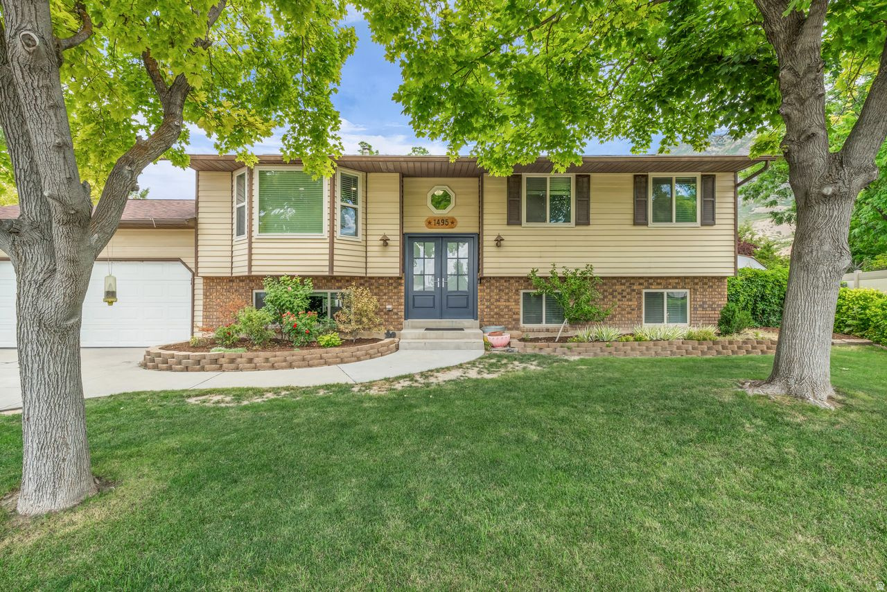 Ideally situated on Pleasant Grove's sought-after east side, this home is tucked away on a quiet cul-de-sac in a well-established neighborhood known for its mature trees, pride of ownership, and welcoming community. Enjoy top-rated schools, nearby parks and trails, convenient shopping and dining, and easy access to Downtown Pleasant Grove and The Ruth. Beautifully maintained with extensive updates, including new roof shingles (2016), windows (2018), furnace and A/C (2021), and water softener (2025). Major interior remodels in 2021 include the living room, kitchen, bathroom, hallway entry, and basement family room, with the primary bedroom remodeled in 2024. Two upstairs bedrooms feature new luxury stone composite flooring (2025). Kitchen appliances have also been updated with a new refrigerator and dishwasher (2022) and an over-the-range microwave (2024), making this home move-in ready.. Square footage figures are provided as a courtesy estimate only and were obtained from county records. Buyer to verify all.