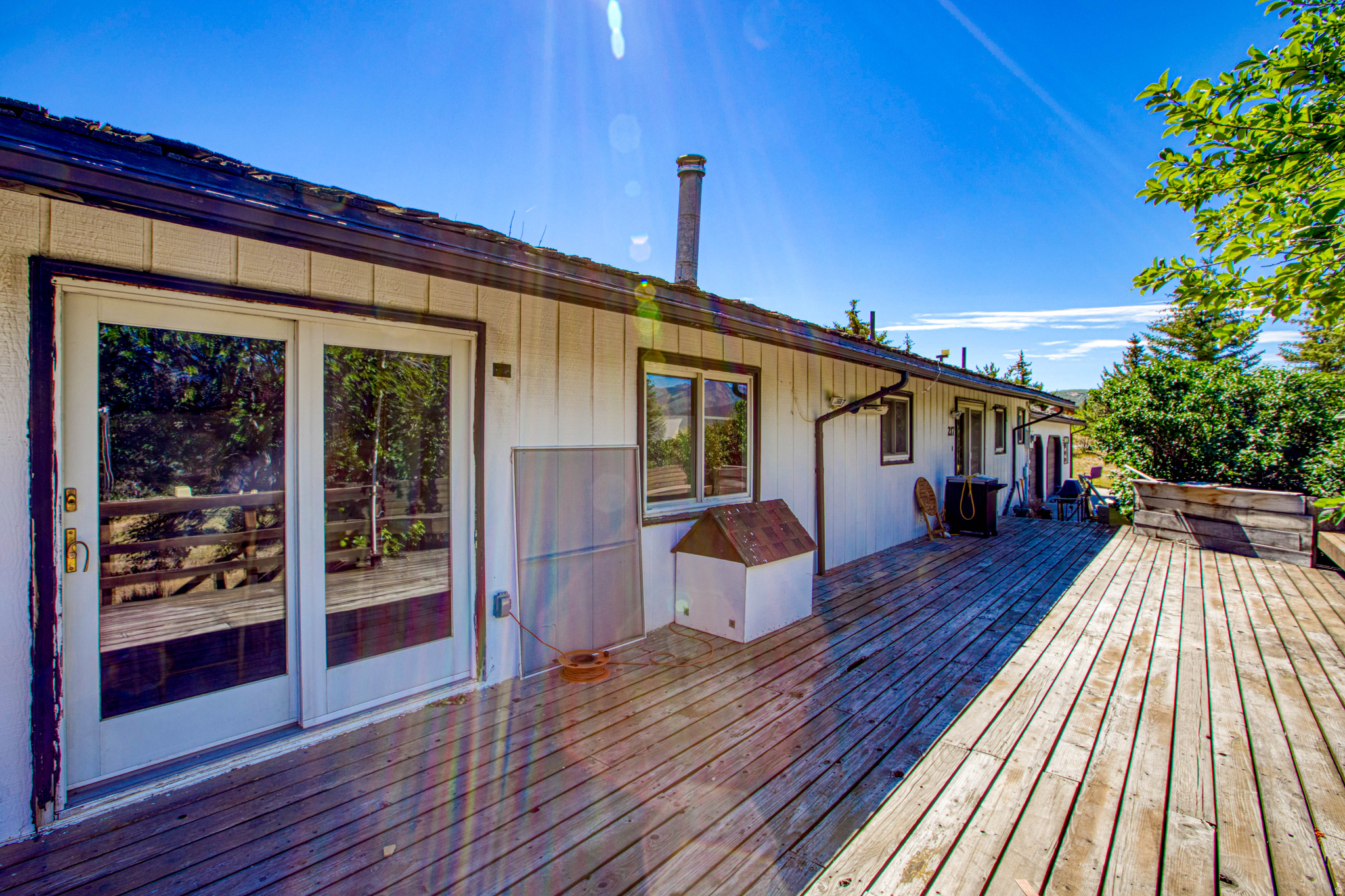 Perfectly located in a quiet area of Park City, with horse riding trails nearby. This home is set up to have the basement completed for an ADU & workshop.   This home features an amazing front porch, over 2 acres, pull through garage & a new septic system.