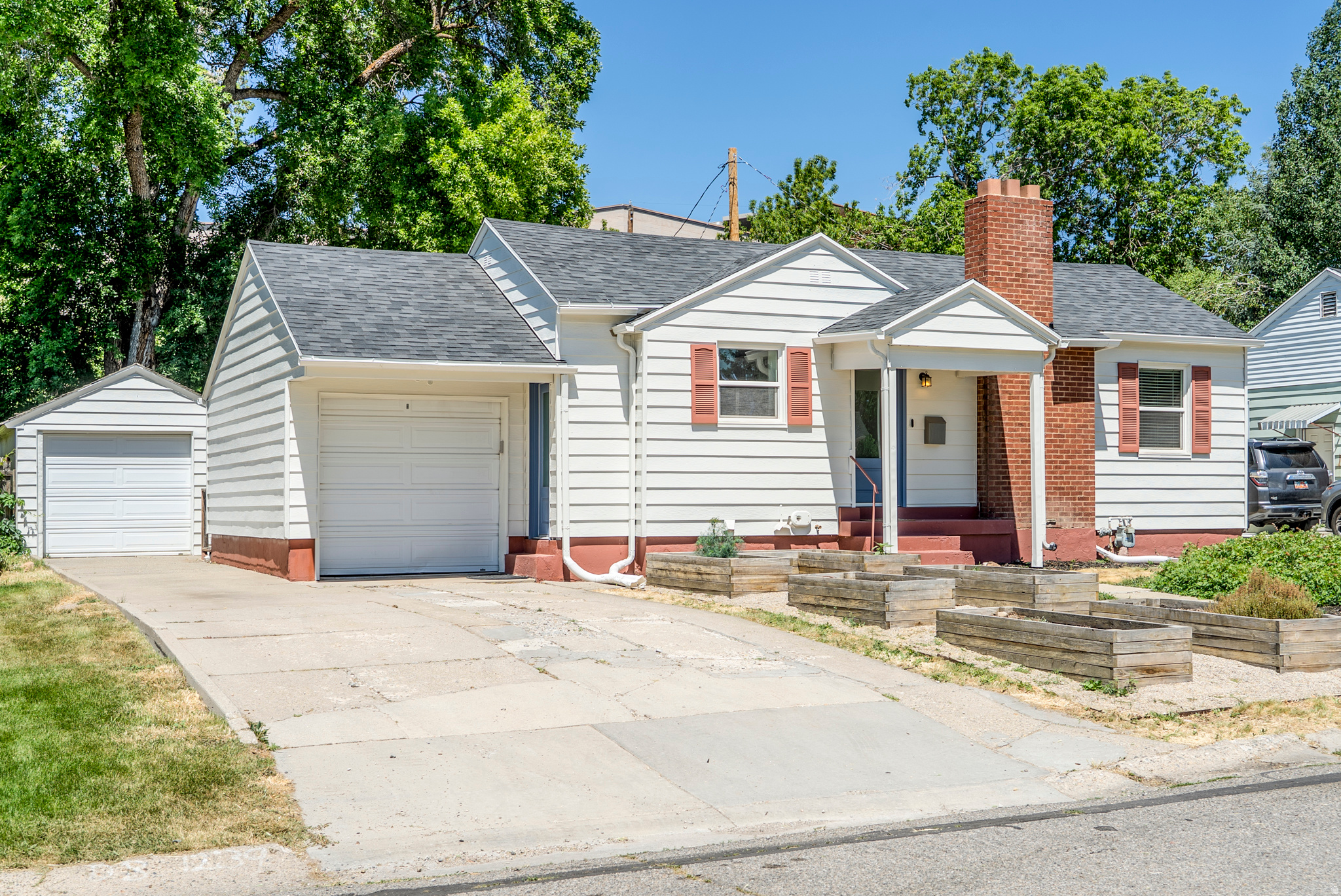 This thoughtfully updated Brickyard home blends comfort, sustainability, and everyday convenience in one of Millcreek's most walkable and sought-after neighborhoods. Recent major upgrades include a new roof, new interior and exterior paint, and a brand-new gutter system, offering peace of mind and added value for years to come. Inside, you'll find exceptional storage throughout the home, including the attic and both garages, making it easy to stay organized without sacrificing living space. The beautifully xeriscaped front yard showcases stunning Great Basin native plants that require zero supplemental water, along with garden boxes equipped with dedicated water lines for easy growing. Water shares are also available for purchase, providing access to irrigation water and potential long-term savings. The location is truly hard to beat. Enjoy easy access to nearby parks and trails, plus all the amenities and community events at Millcreek Common, including seasonal markets, outdoor concerts, ice skating, and year-round recreation. Stroll through this highly walkable neighborhood to local favorites like Harmons Grocery, The Brickyard Shopping Center, and dining at Tres Hombres just around the corner. This is a home designed to support an active, connected lifestyle while keeping maintenance simple and everyday living effortless.