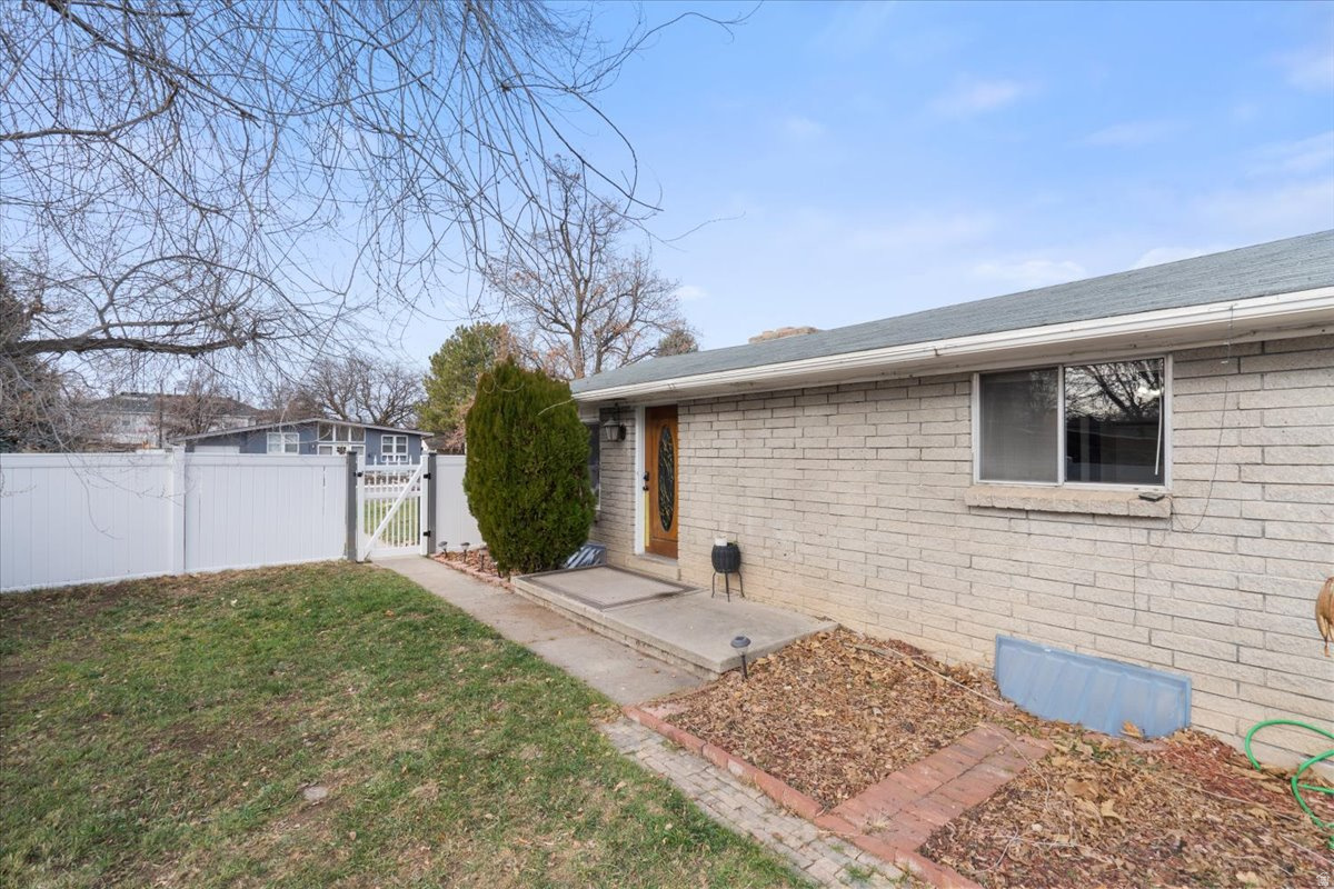 Conveniently located in the heart of Orem, in a community reinvestment zone which qualifies for a 3% down CRA housing loan with no upfront mortgage insurance.   Located just minutes from schools, UVU, and shopping, this charming 4-bedroom, 2-bath home offers comfort and versatility. The main floor is filled with natural light and features hardwood floors, a welcoming family room, and a cozy fireplace. The kitchen includes some tasteful upgrades such as stainless steel appliances (dishwasher and refrigerator), updated countertops, and modern fixtures. The fully finished basement adds excellent flexibility with a second mother-in-law kitchen and a wood-burning stove, perfect for extended family or additional living space. Outside, enjoy a large, flat, fully fenced backyard with mature trees and stunning mountain views, ideal for entertaining, relaxing, or outdoor activities.