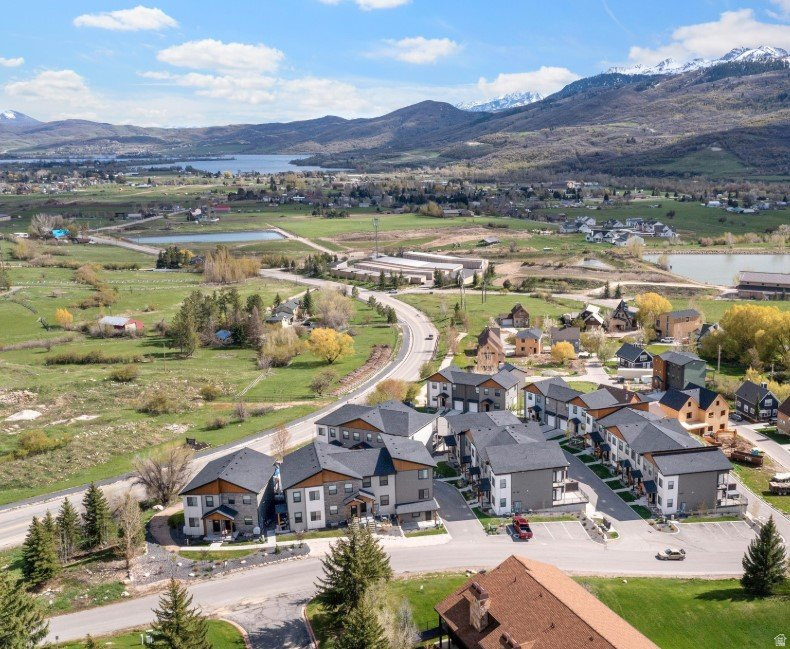 **Discover Your Dream Retreat**  Welcome to this stunning 2020 Built Home, perfectly nestled in the paradise of Eden at Wolf Creek Resort. This rare gem offers expansive views that will take your breath away, showcasing the beauty of the surrounding mountains and lush landscapes. Whether you're looking for a peaceful retreat or a lucrative investment opportunity, this property is an exceptional find!  AirDNA projects $50K in yearly revenue. Step inside and be greeted by an abundance of natural light that flows throughout the open-concept living spaces. Generously sized bedrooms provide ample room for relaxation and rejuvenation, making it the ideal sanctuary. Imagine sipping your morning coffee on your private hidden patio, or unwinding under the stars with loved ones on warm summer evenings.  This fully furnished home is ready for you to move in and start enjoying the resort lifestyle right away. With a convenient attached, oversized, one-car garage, you'll have all the space you need for storage and parking.   Perfectly suited for short-term rentals, a second home, or as your own personal oasis, this Twin Home is a versatile opportunity. The amenities don't stop there  the HOA covers maintenance, snow removal, and even permits pets, allowing you to enjoy a hassle-free lifestyle. Located at the base of Powder Mountain Ski Resort with Views of Snowbasin Ski Resort.  WOWZA!  Don't miss out on your chance to own a slice of paradise in Eden at Wolf Creek Resort. Schedule a private viewing today and let this remarkable home captivate your heart!  NOTE:  Sold fully furnished at no additional charge.
