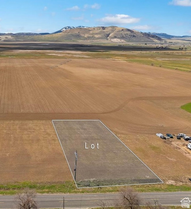 Beautiful flat 1 acre buildable lot in Amaga with feasibility completed.  Includes 1 full water share with power and water at the road.  Bring your own builder. No HOA. Property is currently in Greenbelt.  Enjoy open space, mountain views, and peaceful Cache Valley living. Buyer to verify all information.
