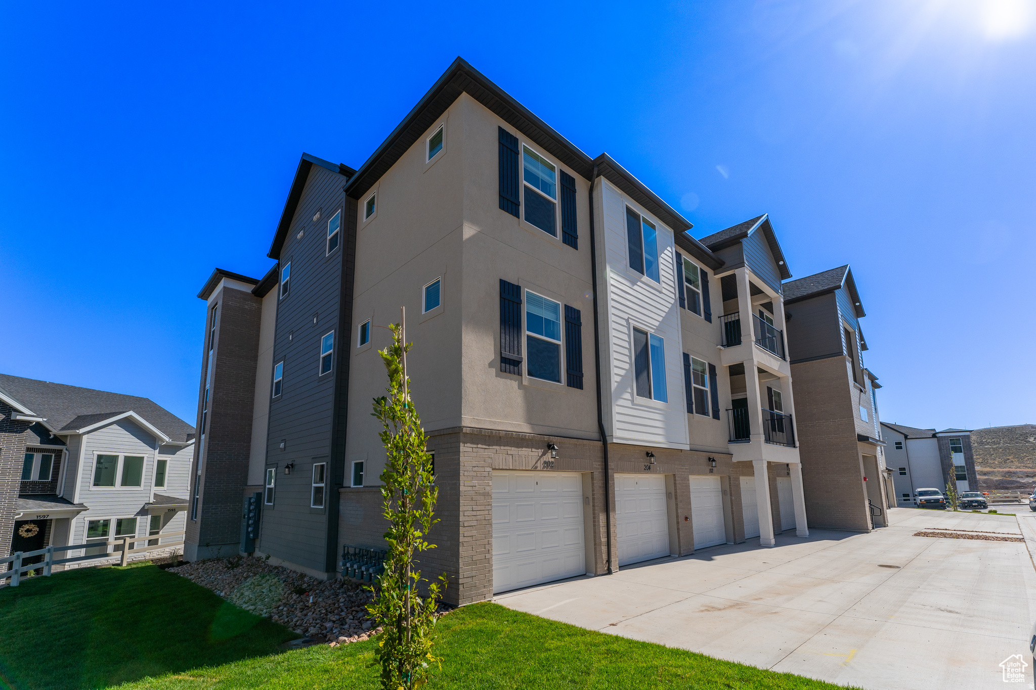 This is a Short Sale. Discover modern living at its best in this brand-new Edge Homes condo featuring 3 spacious bedrooms, 2 bathrooms, and a 1-car garage with windows. Thoughtfully designed with an open-concept layout, this home showcases beautiful finishes, abundant natural light, and a contemporary kitchen perfect for entertaining or relaxing. Enjoy sweeping views that set this unit apart from others in the community-an ideal backdrop for both morning coffee and evening sunsets. The primary suite offers a serene retreat with a walk-in closet and private bath, while two additional bedrooms provide flexible space for guests, a home office, or hobbies. Close to shopping, dining, parks, and major commuter routes, this home blends convenience with style in one perfect package.