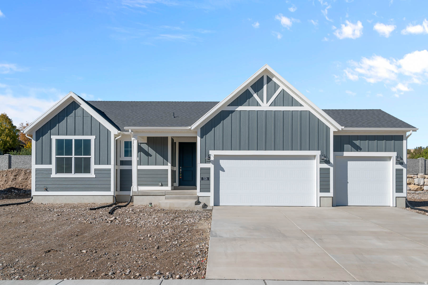 This beautifully designed 1700 Farmhouse blends timeless charm with thoughtful amenities. The kitchen features white laminate cabinets, quartz countertops, and stainless steel gas appliances, complemented by laminate hardwood, vinyl tile, and carpet flooring throughout. Enjoy the convenience of a 3-car garage with keypad & exit door, while features such as can lighting, Christmas light outlets, and energy-efficient options including a tankless water heater provide comfort and cost savings. Interior highlights include Craftsman base & casing and a wood railing at the stairway. The owner's suite boasts a walk-in shower with glass doors and satin & brushed nickel hardware offering a relaxing retreat with a modern finish. All located in a great community at a great price!
