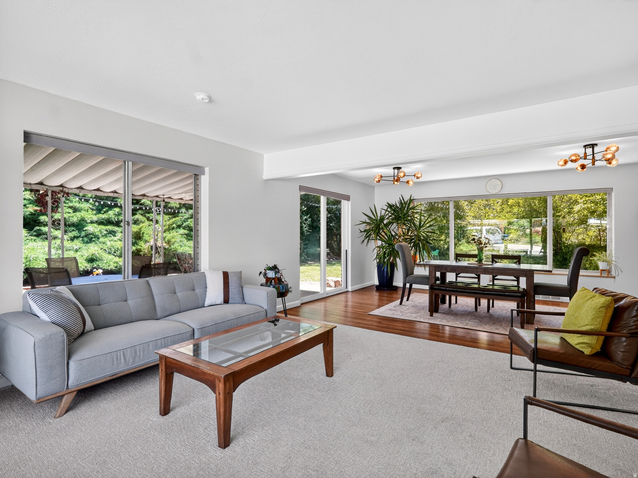 Classic mid-century charm meets everyday functionality in this well-maintained rambler featuring all three bedrooms on the main floor and large windows that bring in natural light while overlooking the private backyard. The thoughtful layout offers spacious gathering areas and a welcoming flow throughout the home. The kitchen showcases beautifully preserved retro character with a robin's egg blue cooktop and oven, complemented by a practical breakfast bar and ample workspace. Original details and unique design elements throughout the home add warmth and personality. Situated on a generous .28-acre lot, the backyard provides plenty of room to relax, or entertain while enjoying a sense of privacy. An oversized two-car garage offers exceptional storage and parking flexibility while the d. Conveniently located near schools with easy access to skiing, Pineview Reservoir, hiking trails, and climbing areas, this home combines timeless style, outdoor recreation, and everyday convenience in one appealing package.