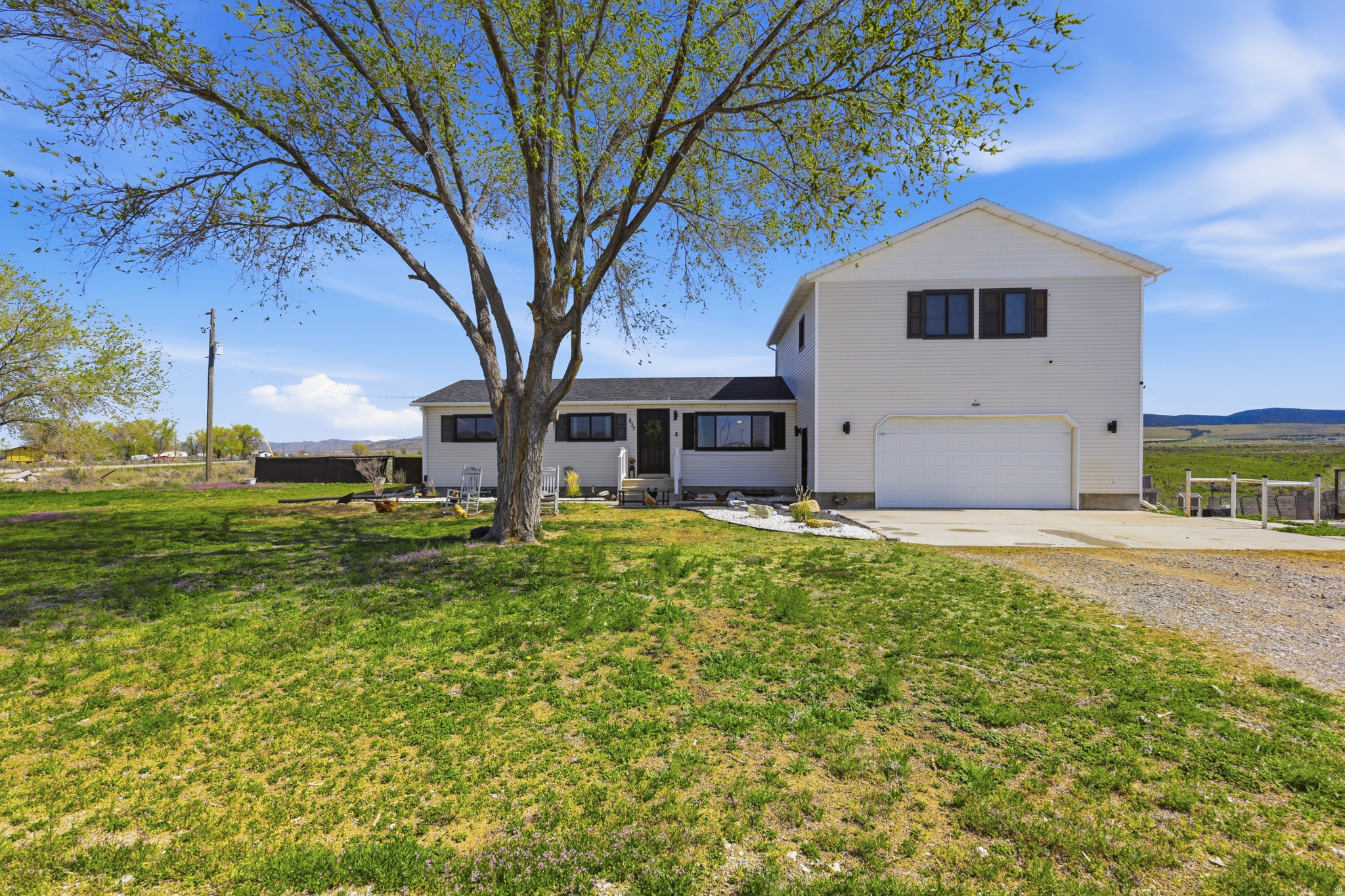 Experience the opportunity for rural living with this 4-acre homestead offering space, flexibility, and hobby farm potential. This rambler-style home features multiple living areas, including family rooms on both the main level and a fully finished walkout basement. The private upper-level primary suite is the perfect retreat. The acreage provides room for a variety of uses - bring your chickens, goats, and horses. Zoned for single-family and agricultural use, the property supports animals, gardening, and the possibility of additional outbuildings. The outbuildings include a 10x12 shed; 4x8 raised chicken coop with 120 square foot run; 8x17 walk in chicken coop; and 8x14 livestock shed. The large attached garage provides plenty of storage for vehicles, tractors, side-by-sides and more. Enjoy the large deck overlooking the property where you can enjoy peaceful evenings and quiet mornings where you can indulge in an atmosphere of complete happiness. Enjoy the country life with no limits, just simply, pure country. Square footage figures are provided as a courtesy estimate only and were obtained from County Records. Buyer is advised to obtain an independent measurement.