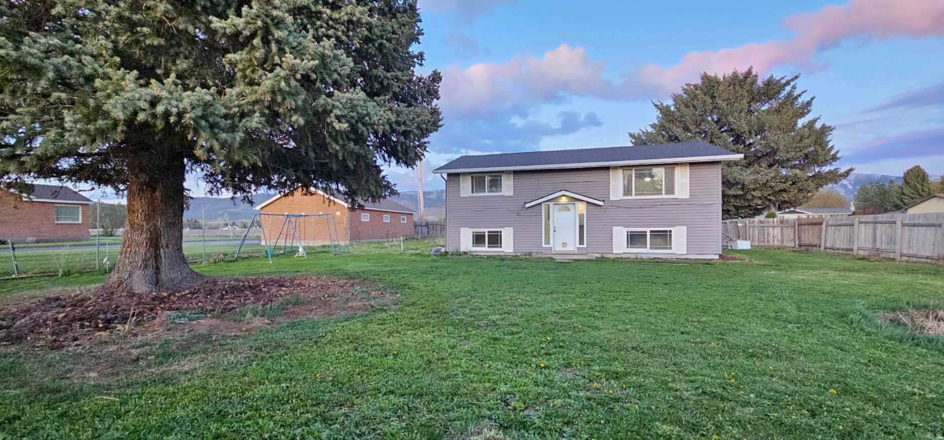 This split-level home with a walk-out basement offers incredible potential for investors and homeowners alike. 5 bed 2 bath, large laundry room, tons of storage space, new flooring and paint! The walk-out basement creates excellent potential for a future mother-in-law apartment. Walking distance to schools, the yard is fully fenced to enjoy your privacy! Easy to show so make your appointment today.