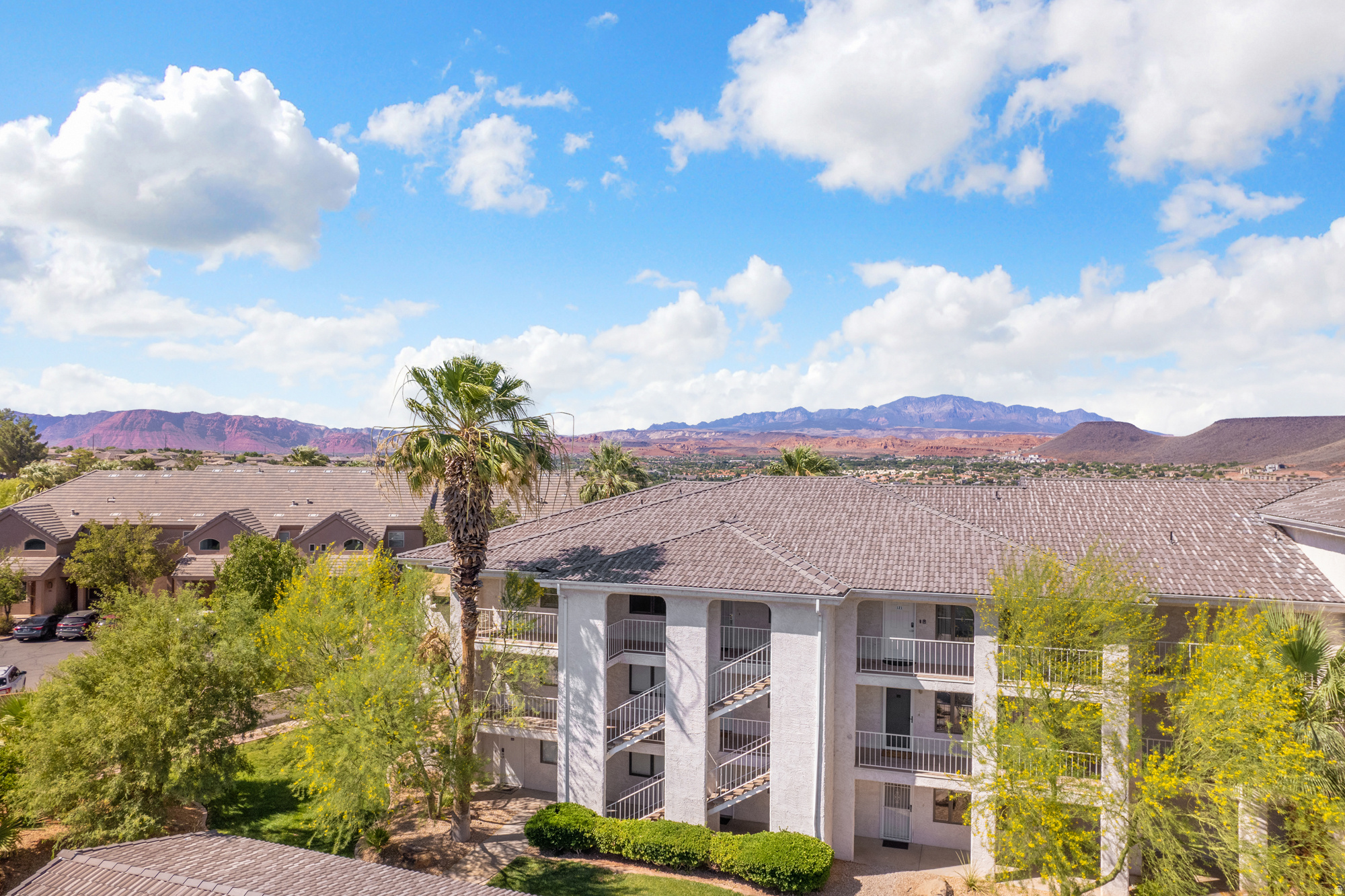 Exceptional Turn Key investment opportunity and resort-style living await in this beautifully maintained 3 bedroom, 2 bath condo located in the highly desirable Las Palmas Resort in St. George. Perched on the top floor, this unit offers spectacular views of the surrounding red rock landscape and stunning sunrise views from the private deck. Whether you're enjoying your morning coffee or relaxing after a day exploring Southern Utah, the scenery is truly unforgettable. Designed for both personal enjoyment and investment potential, the condo includes a stackable  washer and dryer, a private one-car garage, and convenient elevator access for owners and guests. Las Palmas Resort is one of St. George's premier vacation destinations, offering an impressive lineup of amenities including 6 pools, hot tubs, pickleball courts, a splash pad, fitness center, tennis, and clubhouse. The resort's popularity has made it a strong performer for short-term rental income, and rental history is available upon request. Whether you're searching for a vacation retreat, income-producing property, or a combination of both, this 3-bedroom, 2-bath condo is priced to offer tremendous value and an exciting opportunity for the next owner.  Square footage figures are provided as a courtesy estimate only and were obtained from county records. Buyer is advised to obtain an independent measurement.