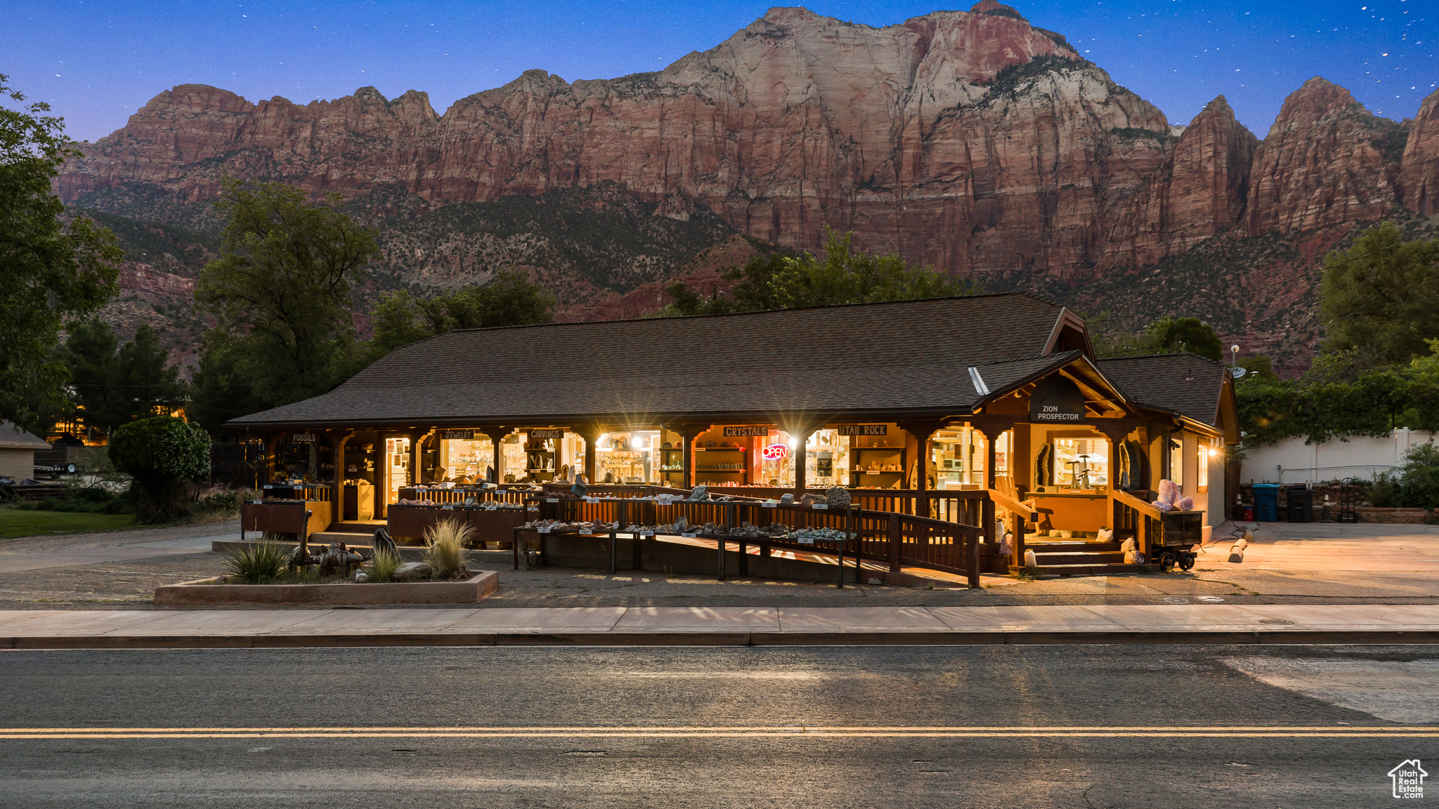 Discover a rare chance to build your life and your business at the gateway to Zion National Park. For over 20 years, this profitable and beloved rock shop has welcomed visitors from around the world, offering unbeatable frontage, high visibility, and the freedom to live steps from your work in vibrant Springdale. You'll enjoy 1,719 square feet of commercial space with good, strong financials, plus a spacious 1,646-square-foot apartment featuring 3 bedrooms and 2 baths-perfect for an owner, staff, or rental income. Additional perks include a 60-square-foot storage basement and a 0.30-acre lot with on-site parking.  Millions of visitors pass by this location each year, making it a prime setting to continue the rock shop legacy or introduce your own vision. The current manager is willing to stay, offering continuity. There is also an opportunity to elevate the business through expanded social media and marketing.  Imagine waking up every day to the red cliffs of Zion glowing outside your window. If you're ready for a new chapter-one fueled by beauty, tourism, and endless potential-this is your moment.