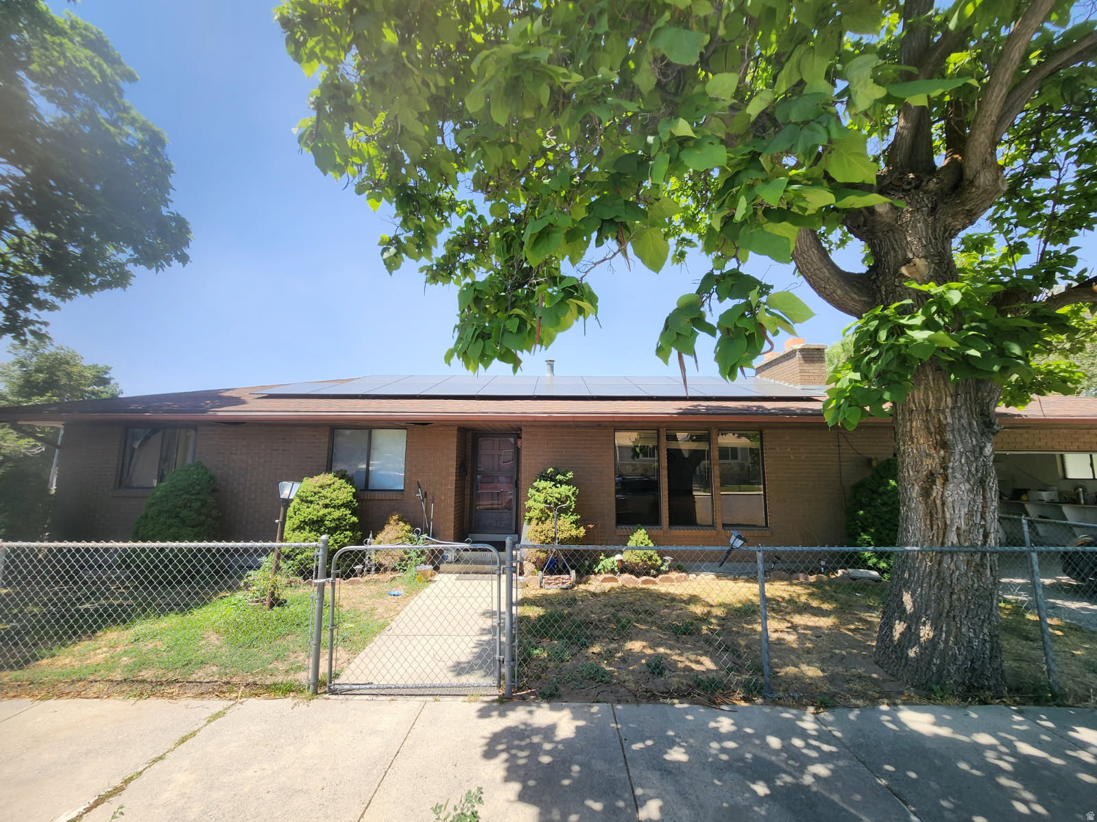 Opportunity awaits! This home offers incredible potential for investors, owner-occupants, or buyers looking to build equity. Featuring a fully equipped basement ADU complete with its own kitchen and laundry, the property provides excellent flexibility for rental income, multigenerational living, or guest accommodations.  One of the standout features is the extensive solar power system with battery backup. The solar panels will be paid off through the sale, allowing the new owner to enjoy the benefits of renewable energy with no solar loan or lease payments.  This property is being sold As-Is and is ready for your vision and updates. Please do not disturb the tenants. All showings are by appointment only, and adequate notice is required to coordinate with the occupants. Call the listing agent for details and showing instructions. Square footage figures are provided as a courtesy estimate only and were obtained from the County.  Buyer is advised to obtain an independent measurement.