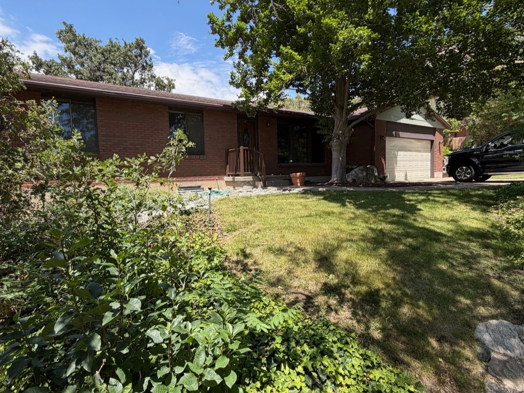 Nestled in the desirable foothills of Davis County, this full brick rambler offers the perfect combination of comfort, convenience, and outdoor living. Located in a welcoming, well-rounded community for all ages, you'll enjoy easy access to shopping, dining, Lagoon Amusement Park, and countless recreational opportunities.  Just minutes from the Bonneville Shoreline Trail, where you can hike, mountain bike, or even ride ATVs to breathtaking valley views. At home, unwind in the beautifully landscaped yard featuring mature trees that provide shade, privacy, and a peaceful setting perfect for relaxing or entertaining.