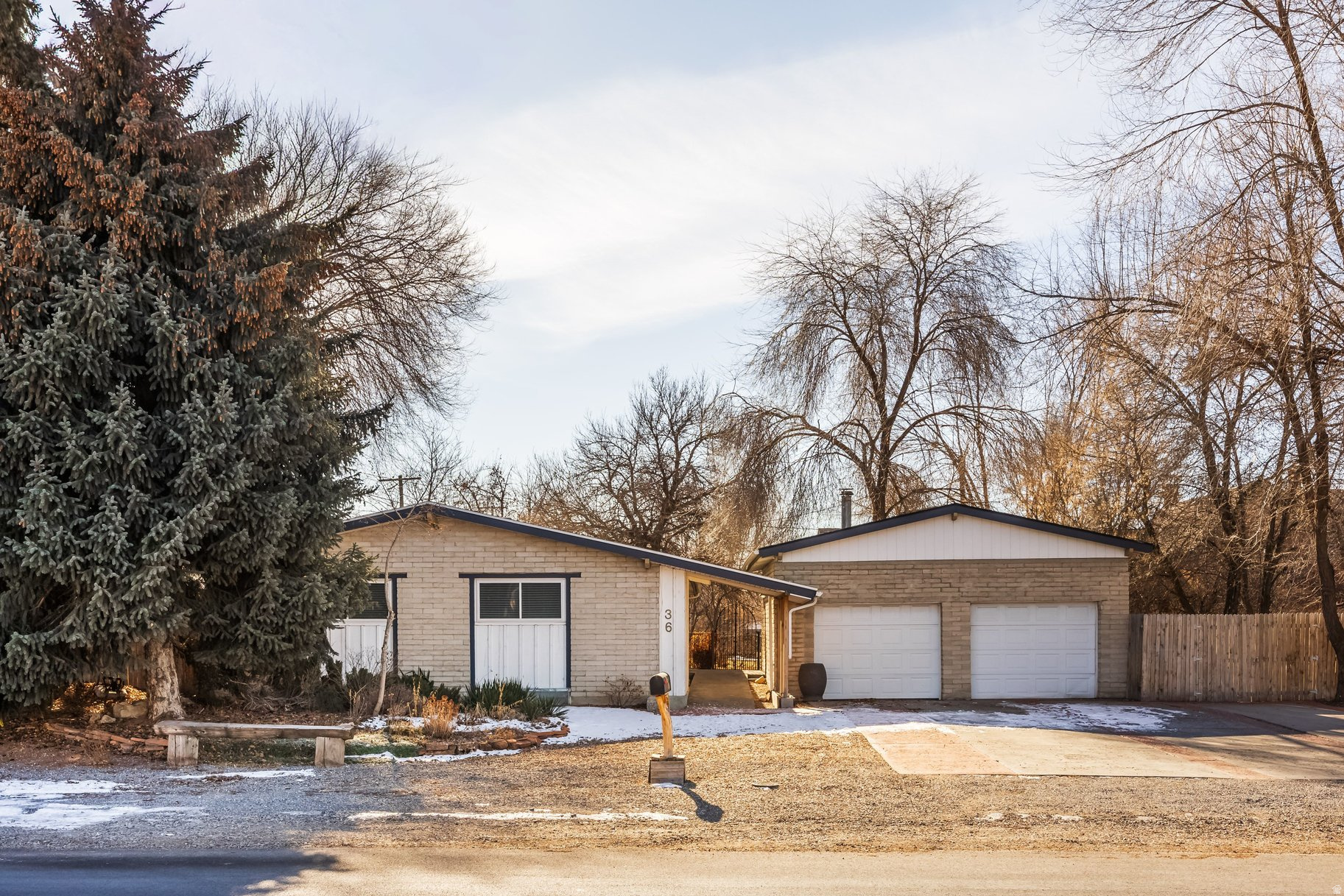 Located in C-2 commercial zoning with visibility from Heber Main Street. Property may accommodate a variety of commercial uses or be utilized as a residential property. Updated home includes two separate units, each with its own entrance, offering flexibility for a variety of living or use configurations. Features include a fully fenced backyard with mature trees and an updated interior. Located near the bus stop providing direct access to Park City and approximately a 10-minute drive to the Deer Valley gondola, this property offers strong potential for short-term rental use, including Airbnb, due to its convenient access to skiing, dining, and year-round recreation.