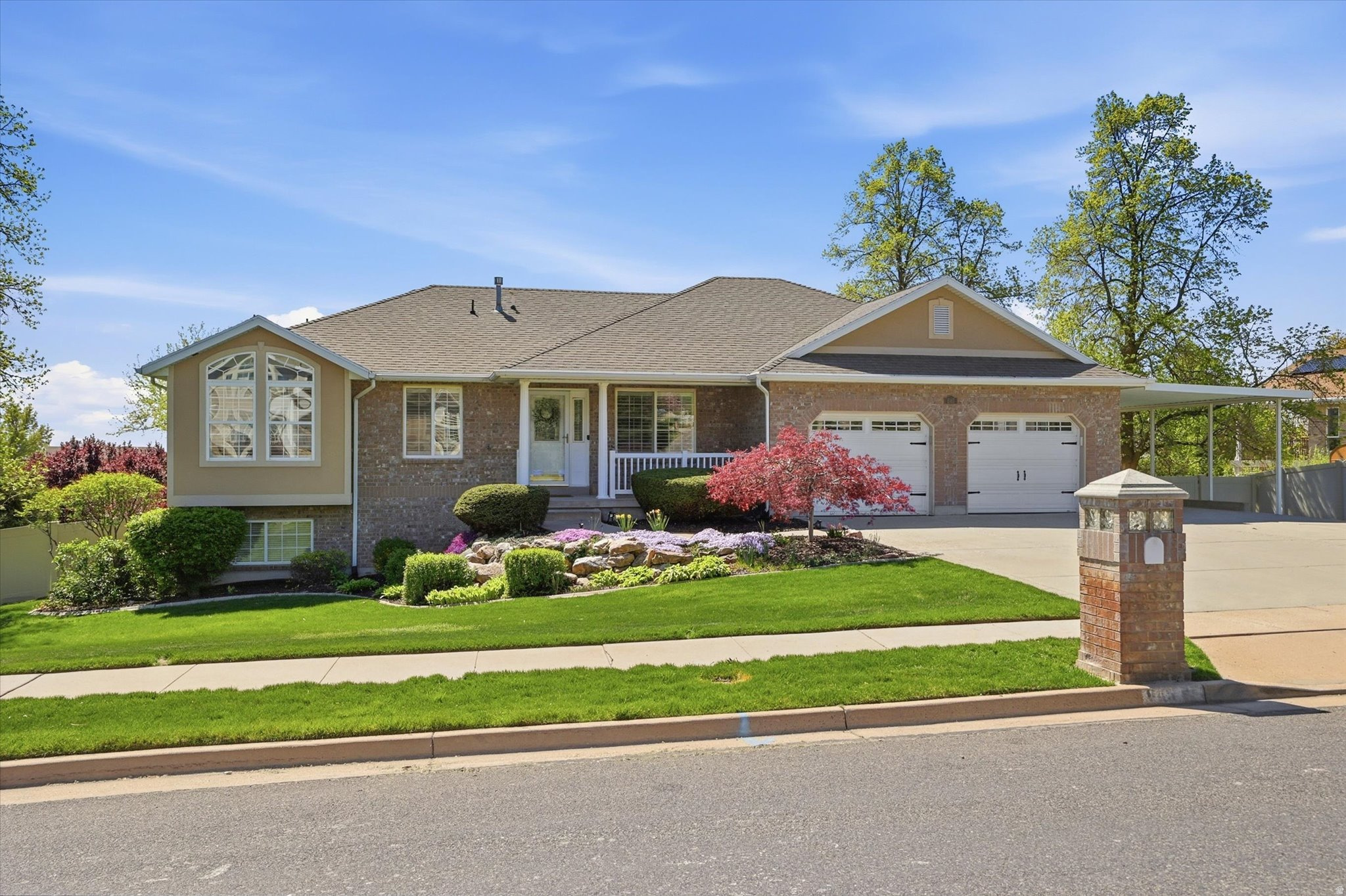 This beautifully updated rambler is nestled on a spacious 0.61-acre lot, offering stunning mountain and valley views. The open floor plan is ideal for both everyday living and entertaining. A large downstairs family room provides the perfect space for hosting family and friends. Step outside to a fully fenced yard featuring mature peach and cherry trees, along with raspberries, strawberries, and plenty of extra room for gardening. The covered deck and patio are both equipped with privacy shades for added comfort. Additional features include a generously sized basement storage room, a powered shed, and a covered carport alongside the two-car garage for extra parking. This property combines comfort, functionality, and exceptional outdoor space. Close to ski resorts, Pineview Reservoir, hiking/biking trails, schools, parks and shopping. All information is provided as a courtesy only. Buyer is advised to verify all info. Square footage figures were obtained from county records