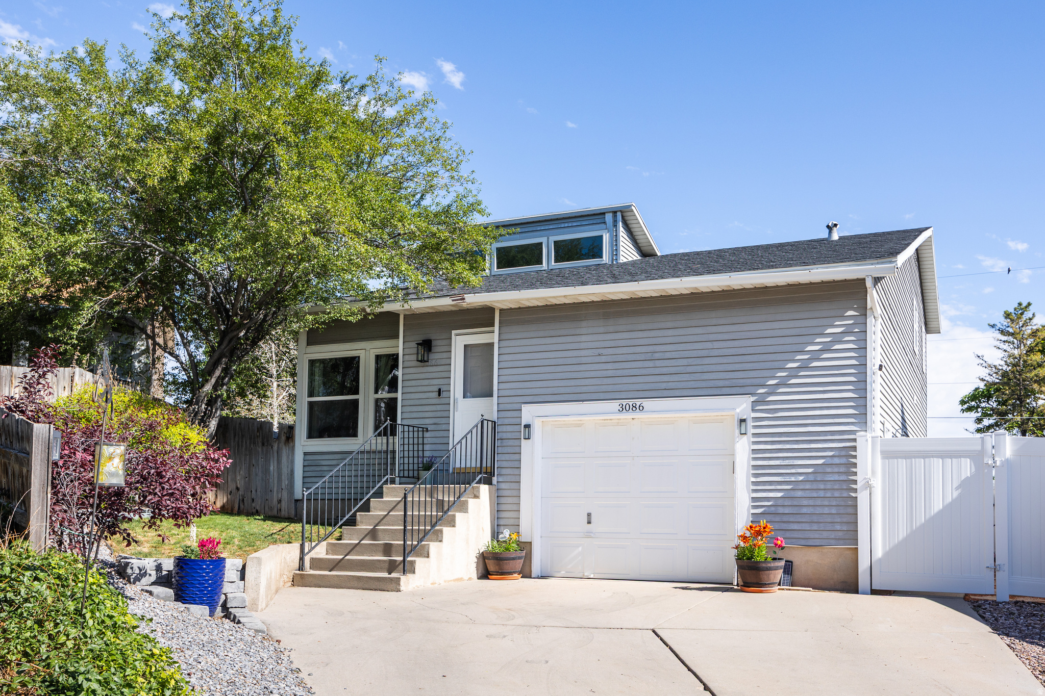 Rarely does a starter home so thoughtfully balance stylish, practical updates with an unbeatable price and location, but Roxborough Park artfully manages it all. Tucked in a quiet cul-de-sac just steps from a grassy community park and play area, this spacious three bed, two bath contemporary home offers soaring ceilings alongside abundant natural light, fresh finishes, and the kind of touches that make for that perfect "welcome home" feeling. With an updated and open kitchen, two new bathrooms, new floors, and an oversized garage, this lofty abode is a rare find at this price point. From a practical standpoint, all new blown-in insulation keeps things efficient, no matter the season, but you can also benefit from new HVAC, windows, and a newer roof (2017)-this is a turnkey, low-maintenance home you'll be able to enjoy for years to come. The fenced backyard offers a concrete patio and firepit area, framed above by a spacious new Trex deck, and a protected garden space (to keep those carrots safe from pets). Community perks include picnic areas, tennis courts, and RV/trailer parking. But perhaps best of all, this quiet, hidden neighborhood provides close proximity to I-215 and I-15, as well as great, locally owned restaurants and good schools. If you've been looking for an affordable, well maintained, and updated starter, this effortlessly cool and comfy spot is sure to tick all the boxes.  Square footage figures are provided as a courtesy estimate onl.y Buyer is advised to obtain an independent measurement.