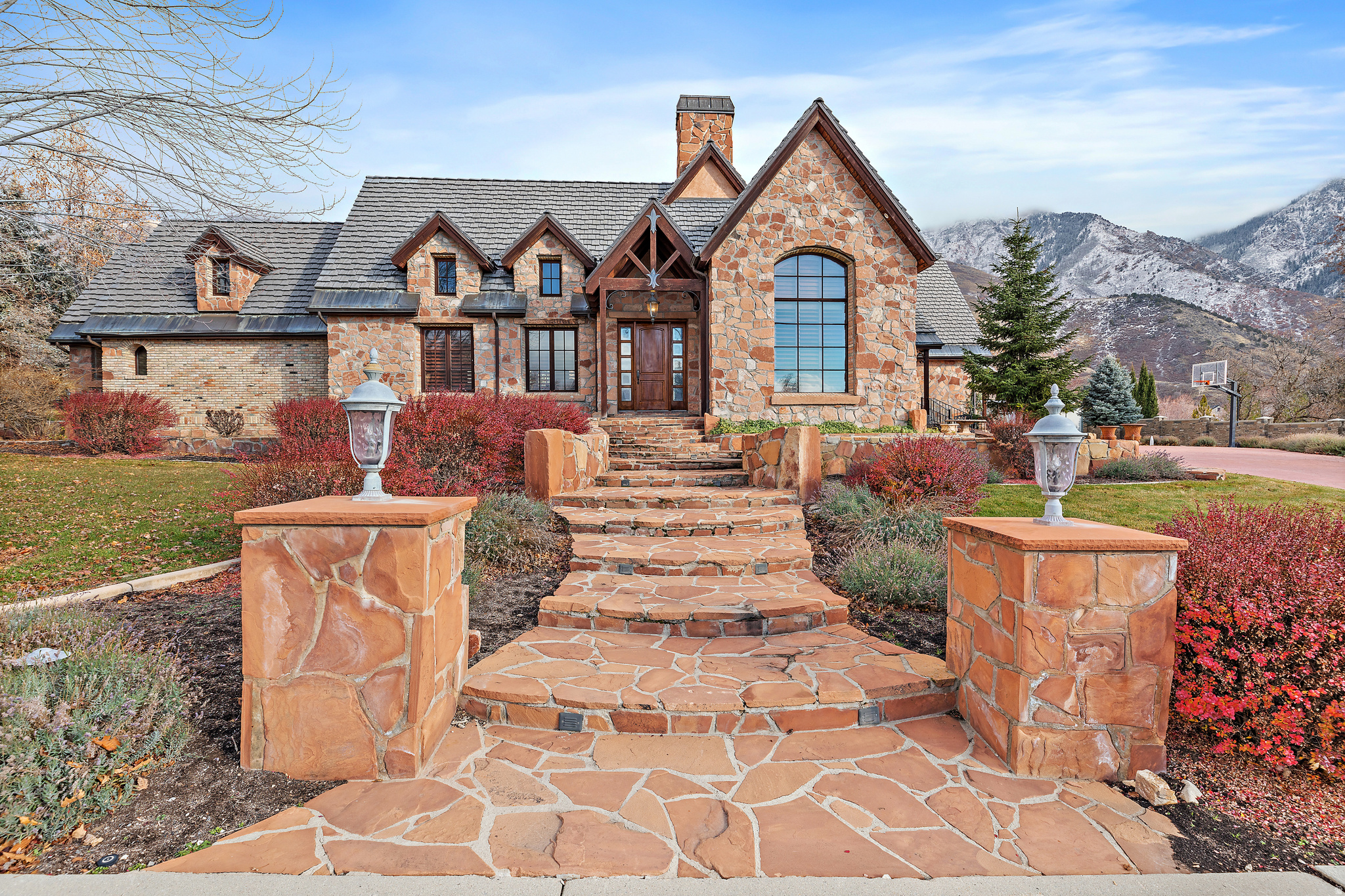 Timeless European luxury residence where architecture, craftsmanship, and setting come together in exceptional harmony. Resting on a pristine acre backing Lambert Park, this property offers unmatched privacy, scenery, and space. Every detail speaks to quality: 12" thick exterior walls, exquisite wood trim, custom finishes, and HIGH-END DESIGN at every turn.  The main floor master suite creates a retreat of its own, while the soaring vaulted family room and expansive entertaining areas invite memorable gatherings. The chef's kitchen elevates daily living with a Viking range, Sub-Zero refrigeration, and elegant custom cabinetry. Oversized windows capture dramatic mountain views and blur the line between impressive indoor and outdoor living.  With a NEW tile roof, HORSE PROPERTY designation, and a quiet cul-de-sac location, this home is both timeless and rare... purposefully built for those who appreciate craftsmanship over short-term trends and quality over quantity.