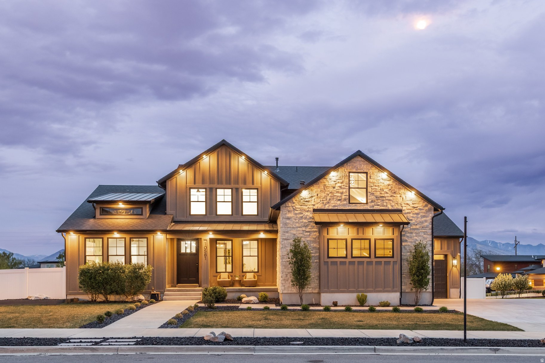 10581 S Verda Circle is a modern luxury home for sale in South Jordan, located on a large corner lot within a cul-de-sac in one of the area's most desirable upscale neighborhoods, This 6-bedroom, 5-bathroom executive residence offers over 5,000 square feet of thoughtfully designed living space, including 2 offices, multiple gathering areas, and a flexible layout ideal for multi-generational living, work-from-home, or entertaining. The home features bright open-concept living spaces enhanced by custom interior lighting and a modern design aesthetic. The gourmet kitchen includes stainless steel appliances, an oversized built-in refrigerator, double wall ovens, and a large walk-in pantry--ideal for everyday living and entertaining. The main living area showcases soaring two-story ceilings and flows seamlessly to a fully fenced backyard, offering a safe and functional space for kids and pets. The lower level expands living options with a wet bar, family room, and two additional bedrooms, offering excellent potential for a mother-in-law suite or guest quarters. The corner cul-de-sac homesite provides enhanced privacy, reduced traffic, mountain views, and a quiet residential setting. The oversized 3-car garage includes 12.5-foot ceilings and a 28 x 13' RV/boat bay, plus an expanded driveway for additional parking. Location is a major advantage. This home is within walking distance to elementary, middle, and high schools, and offers an easy commute to downtown Salt Lake City, Silicon Slopes tech employers, the University of Utah, and Salt Lake City International Airport. Nearby shopping, dining, and amenities add everyday convenience. Outdoor enthusiasts will enjoy quick access to hiking, biking, golf, and Utah's world-class ski resorts. This home combines luxury, space, upgrades, location, and lifestyle--offering one of the best opportunities in today's South Jordan Utah real estate market. Ask about the full list of $75K in owner upgrades.