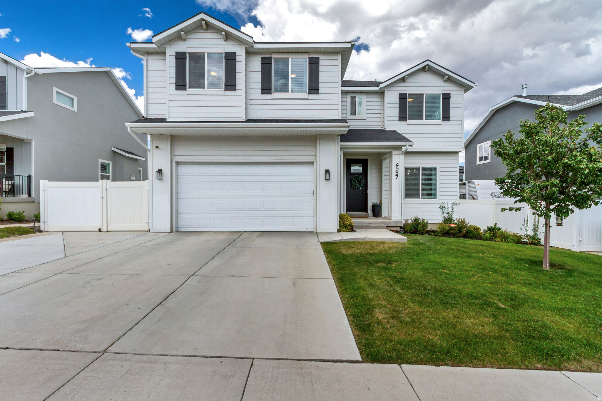 Practically brand-new and meticulously maintained, this beautiful 4-bedroom home offers the perfect combination of modern living, space, and convenience in a quiet, family-friendly neighborhood. The thoughtfully designed floor plan features four spacious bedrooms plus a versatile loft upstairs, ideal for a second living area, home office, or playroom. The oversized primary suite provides a relaxing retreat with plenty of room to unwind. Step outside to a fully fenced, professionally finished backyard that's perfect for entertaining, kids, or pets. An RV pad provides space for your trailer, boat, or recreational vehicles, while the garage is already equipped for Tesla/EV charging. Enjoy the benefits of a low HOA that includes access to a community pool, clubhouse, fitness center, and scenic walking and biking trails. Located just minutes from top-rated schools, shopping, dining, and everyday conveniences, this home offers an unbeatable lifestyle.Need more space? The unfinished basement provides endless potential to customize and add equity with additional bedrooms, a family room, home gym, theater, or storage. This move-in-ready home truly has it all-modern finishes, exceptional outdoor space, room to grow, and an outstanding location. Don't miss your opportunity to make it yours!