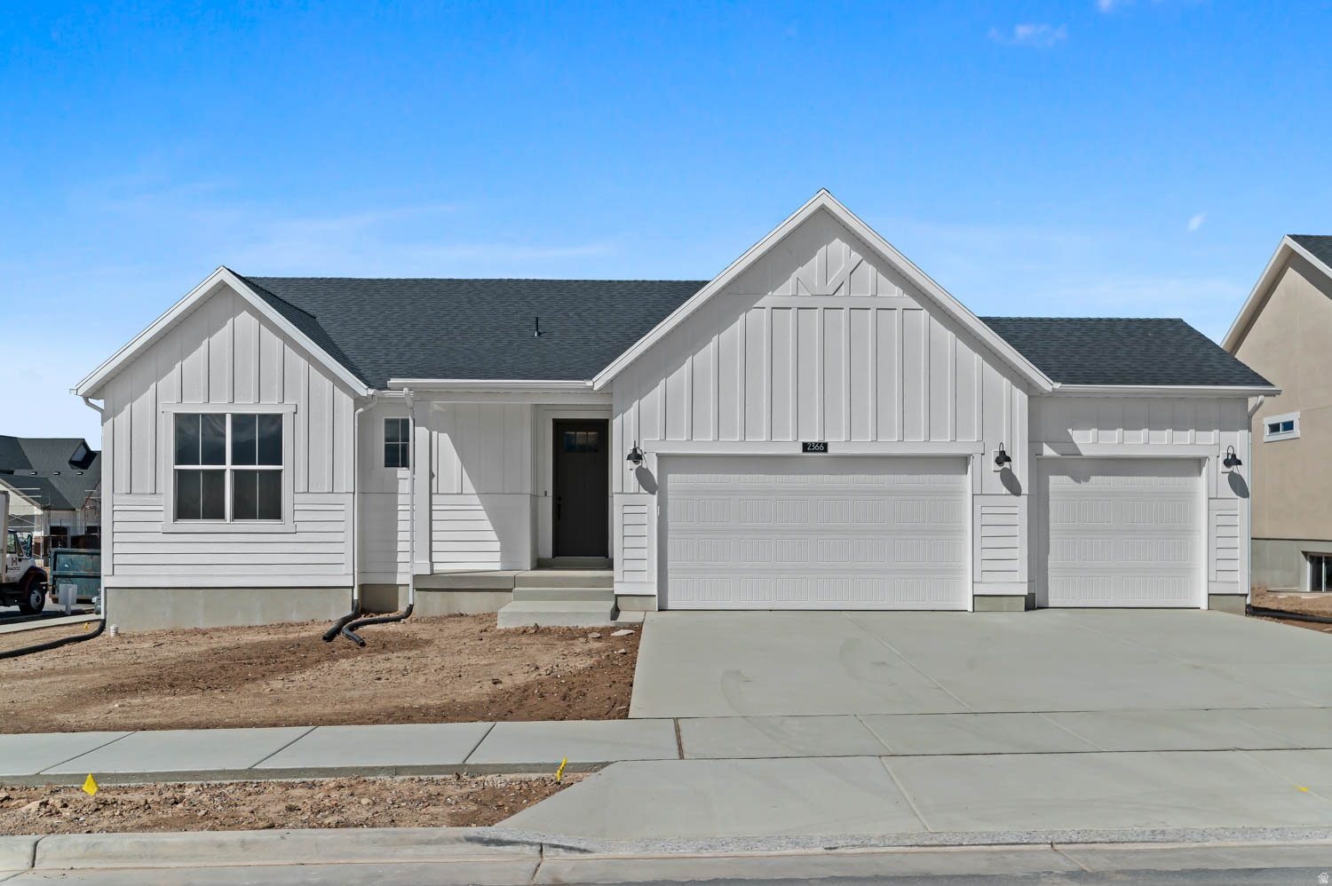 Come see this charming and thoughtfully designed 1700 Farmhouse home blending classic style with modern finishes. The kitchen shines with gray laminate cabinetry, quartz countertops, a stylish tile backsplash, and stainless steel gas appliances. A beautiful box window in the kitchen nook fills the space with natural light and adds architectural character. Enjoy a mix of laminate hardwood, tile, and plush carpet flooring throughout, complemented by large craftsman base and casing, elegant two-tone paint, and sleek black matte hardware. Can lighting enhances the bright and open feel of the main living areas. Relax in the inviting family room featuring a cozy gas log fireplace, while the metal railing at the stairway adds a contemporary touch. The spacious owner's suite includes a box window and a grand bathroom with stunning quartz surrounds for a refined, spa-like finish. Additional highlights include a 3-car garage with keypad entry and exit door, a tankless water heater for energy efficiency, and convenient Christmas light outlets for easy seasonal decorating. Don't miss out on this beautifully finished farmhouse-style home offering comfort, style, and quality details throughout.