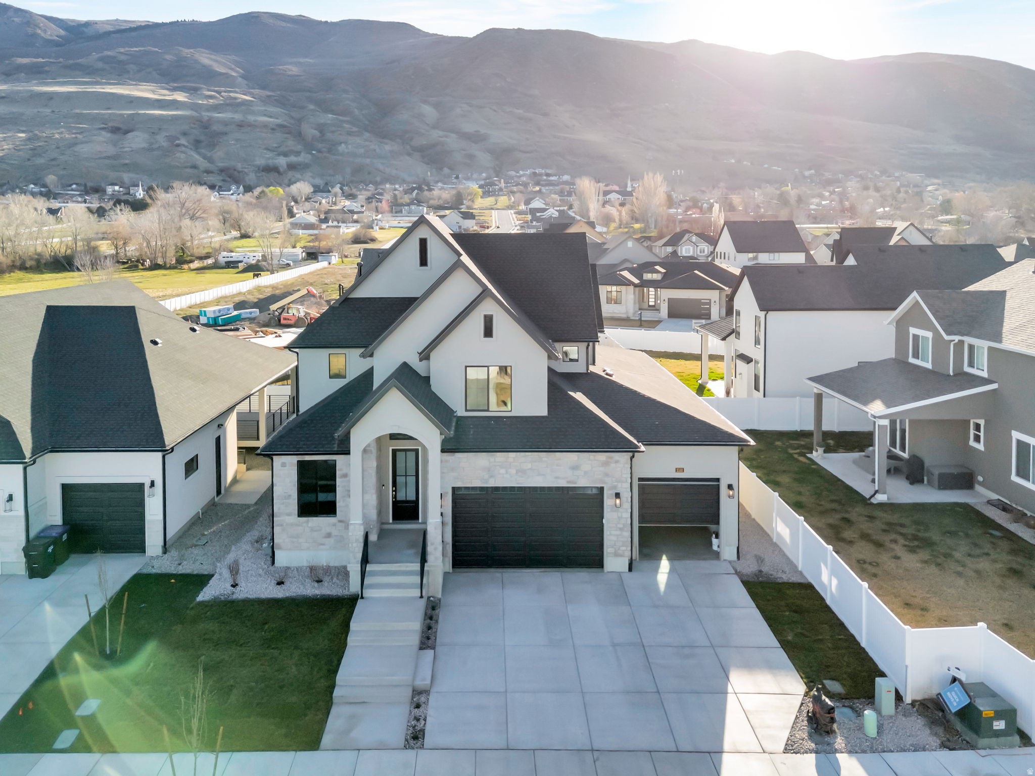 LOT#108 in Summerhill Lane by Symphony Homes. This Libby plan is in a prime location close to everything. Discover the difference in quality from this trusted local builder of semi-custom homes. This spacious two-story offers thoughtful design, high-end finishes, and unique features throughout. The true three-car garage provides ample parking and storage. The main level features a large galley-style kitchen with a walk-in pantry, 36" gas cooktop range, double ovens, a bright dining nook. Just off the entry, a flex room with a stunning custom feature wall adds character and versatility. The family room boasts a soaring two-story ceiling and a beautiful fireplace, creating a warm and inviting space for gathering and entertaining. The main floor also includes the primary suite, complete with an ensuite bath, walk-in closet, and a nearby stackable laundry closet for added convenience. Upstairs, you'll find a generous loft that overlooks the family room below, two additional bedrooms-each with walk-in closets-and a large laundry room. The finished basement includes a spacious family or game room, two more bedrooms and a bath. Plus, it's stubbed for a future wet bar if you wish to add it, and has plenty of storage. A covered patio extends your living space outdoors, and the home is equipped with an active radon system and secondary water stubbed to the lot.